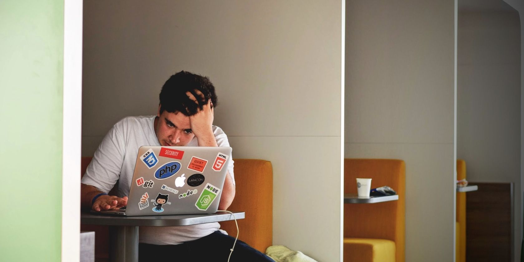 man frustrated on laptop