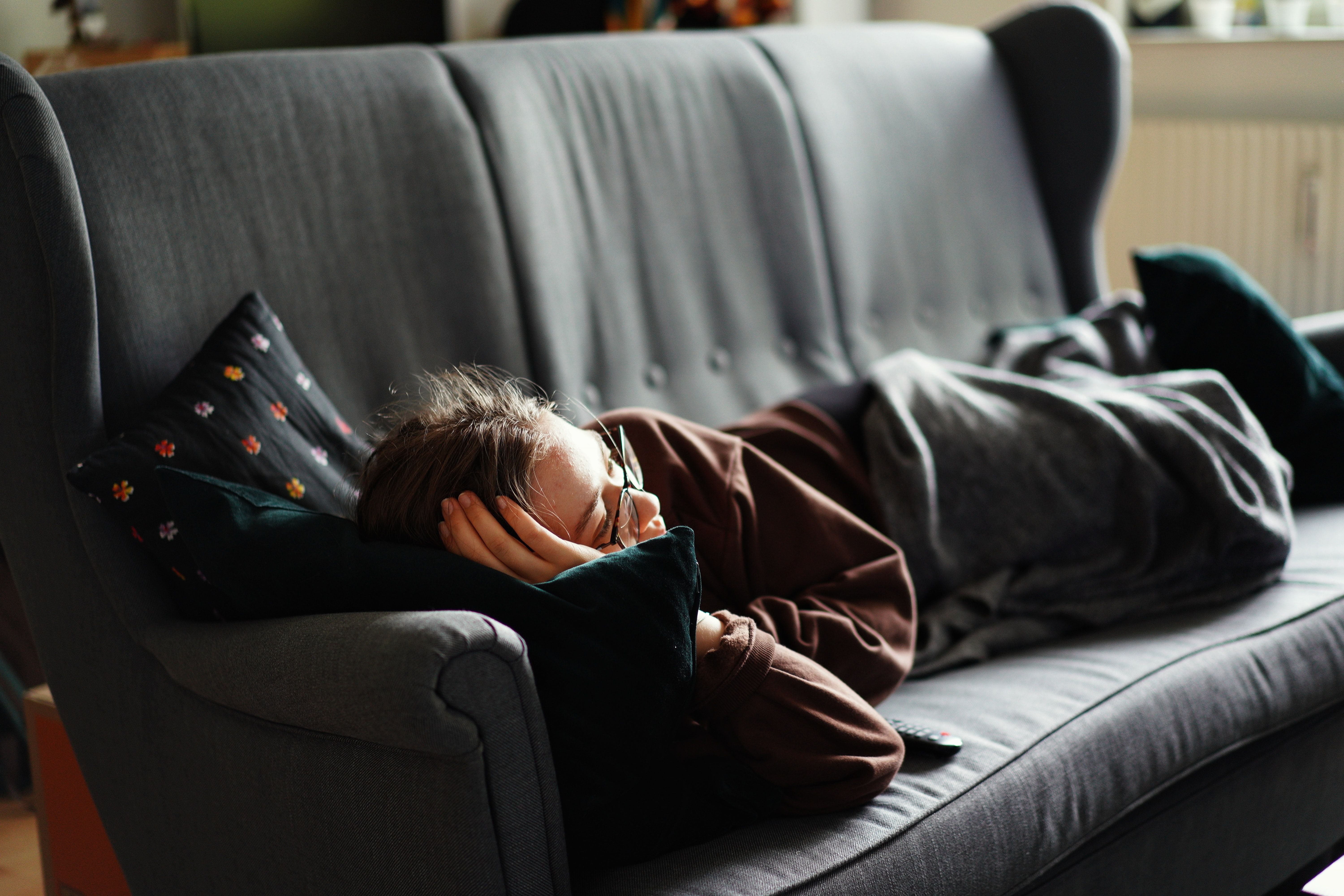 Person napping on couch