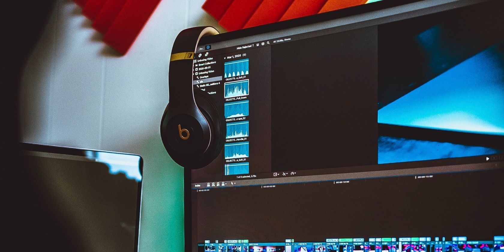 A monitor with some headphones.