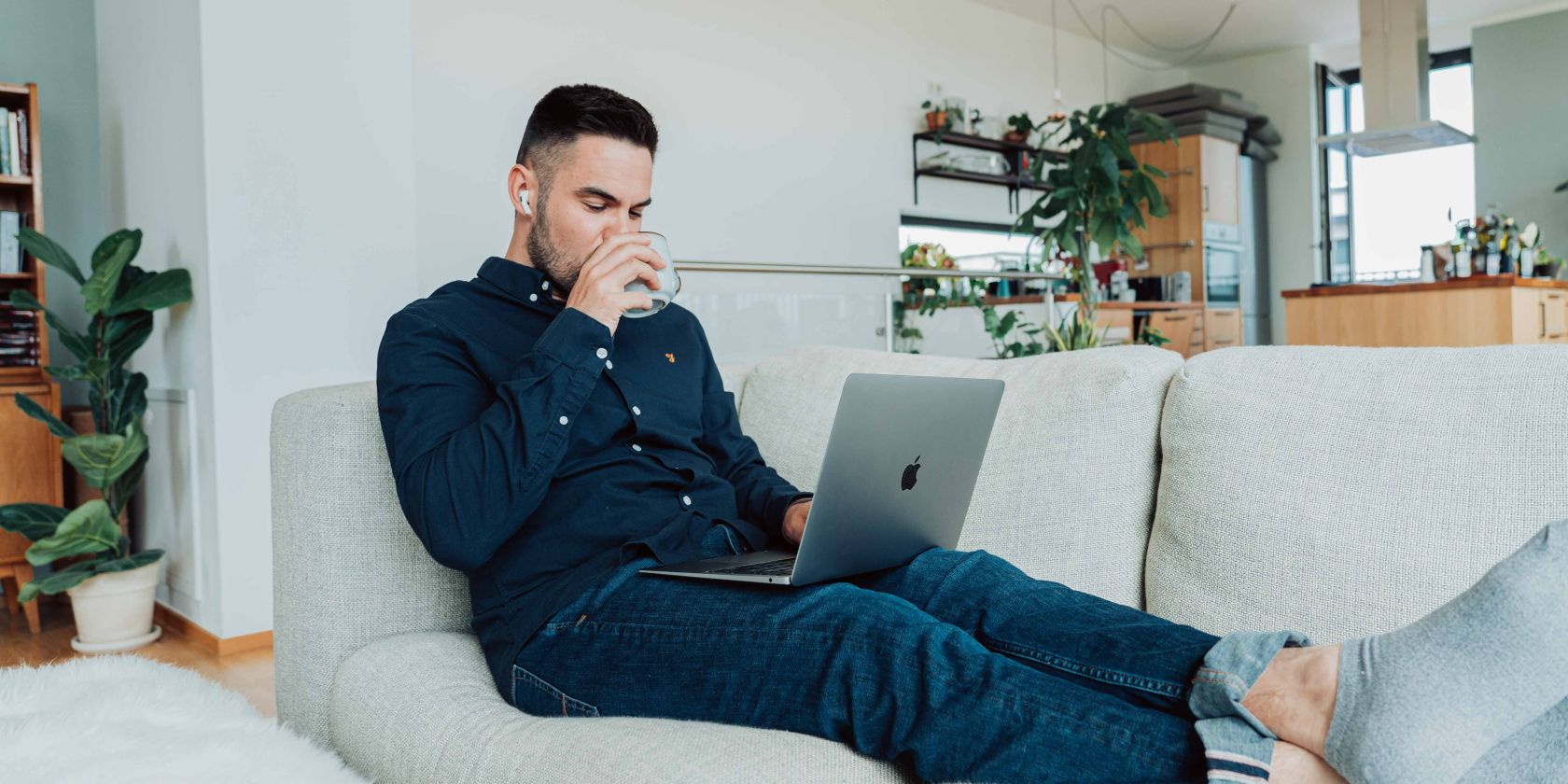 person on couch with laptop