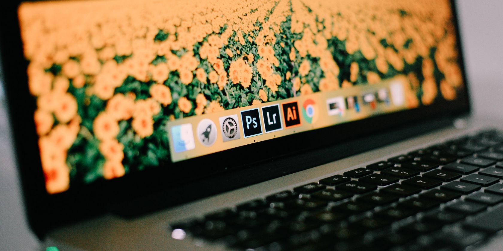 Photo of various Adobe logos on a Mac's dock