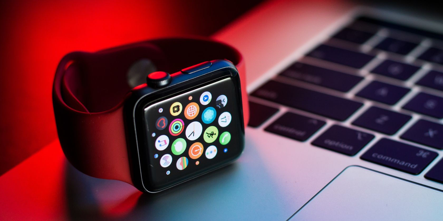 Photo of an Apple Watch on top of a Mac