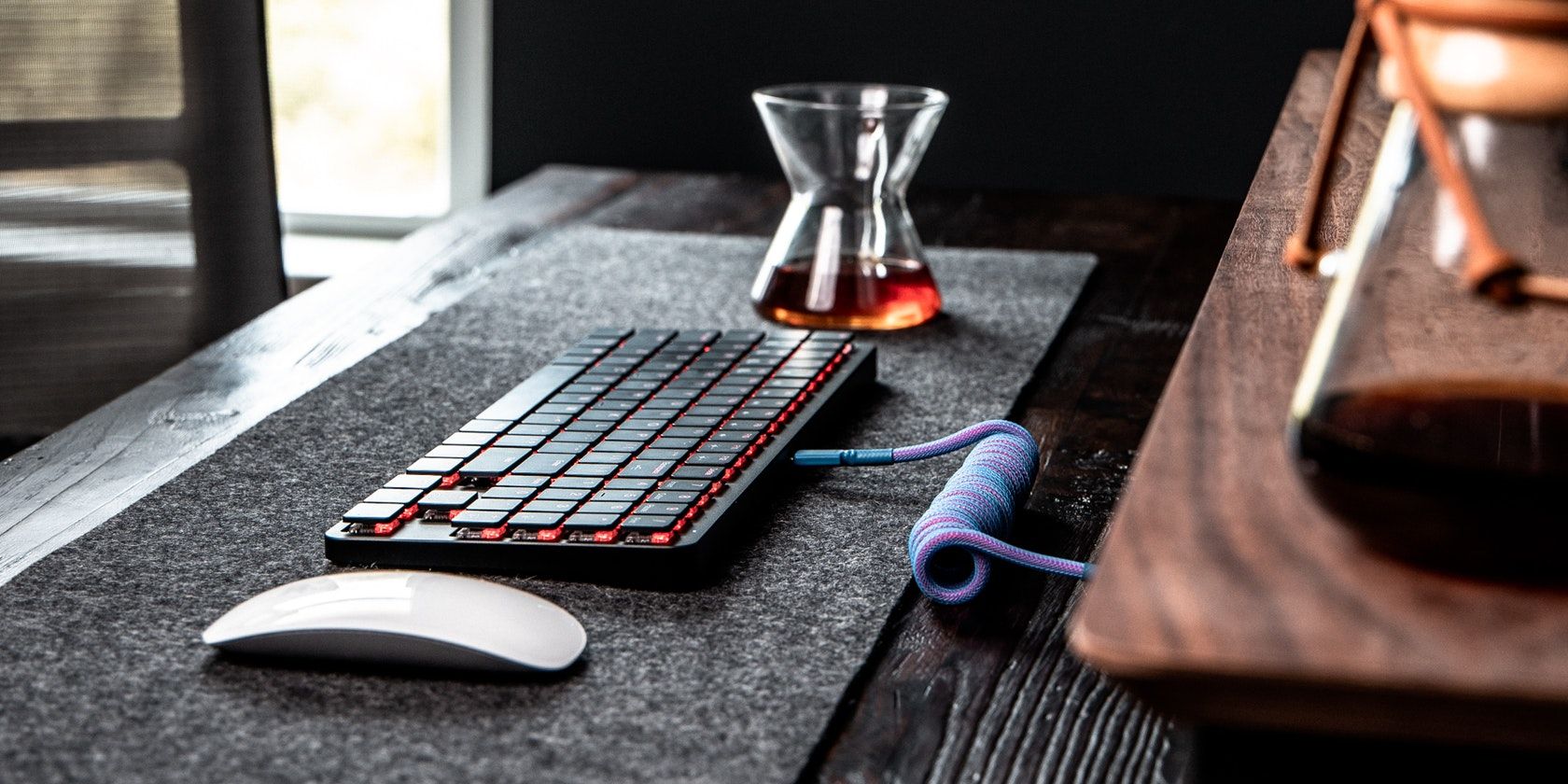 Keyboard and Mouse Placed on a Pad on Working Table