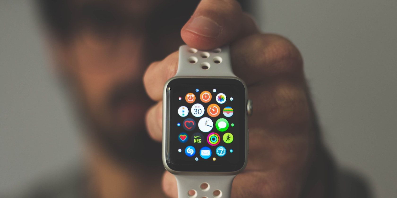 Person holding Apple Watch featured