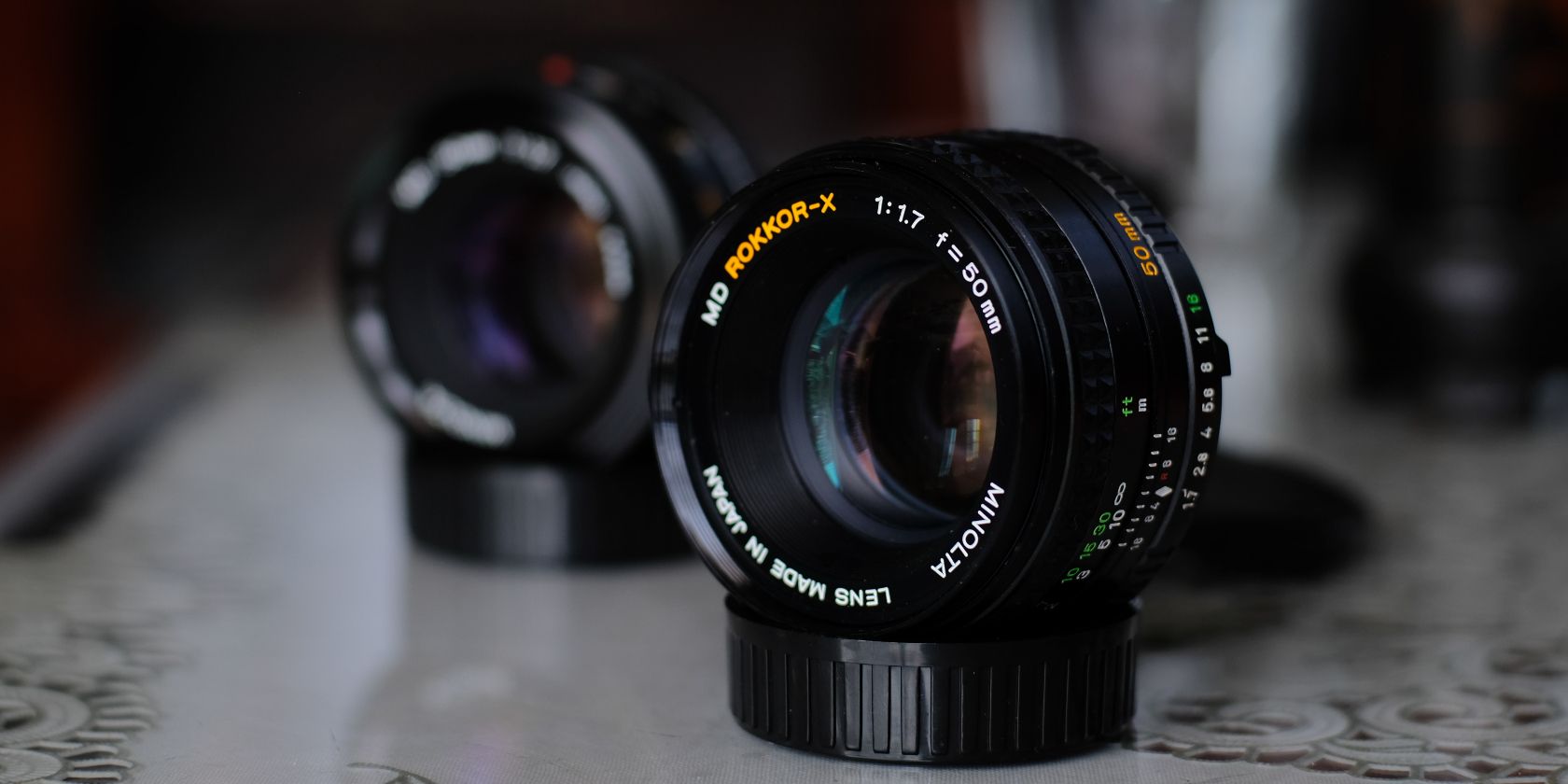 Photo of two prime lenses on a table