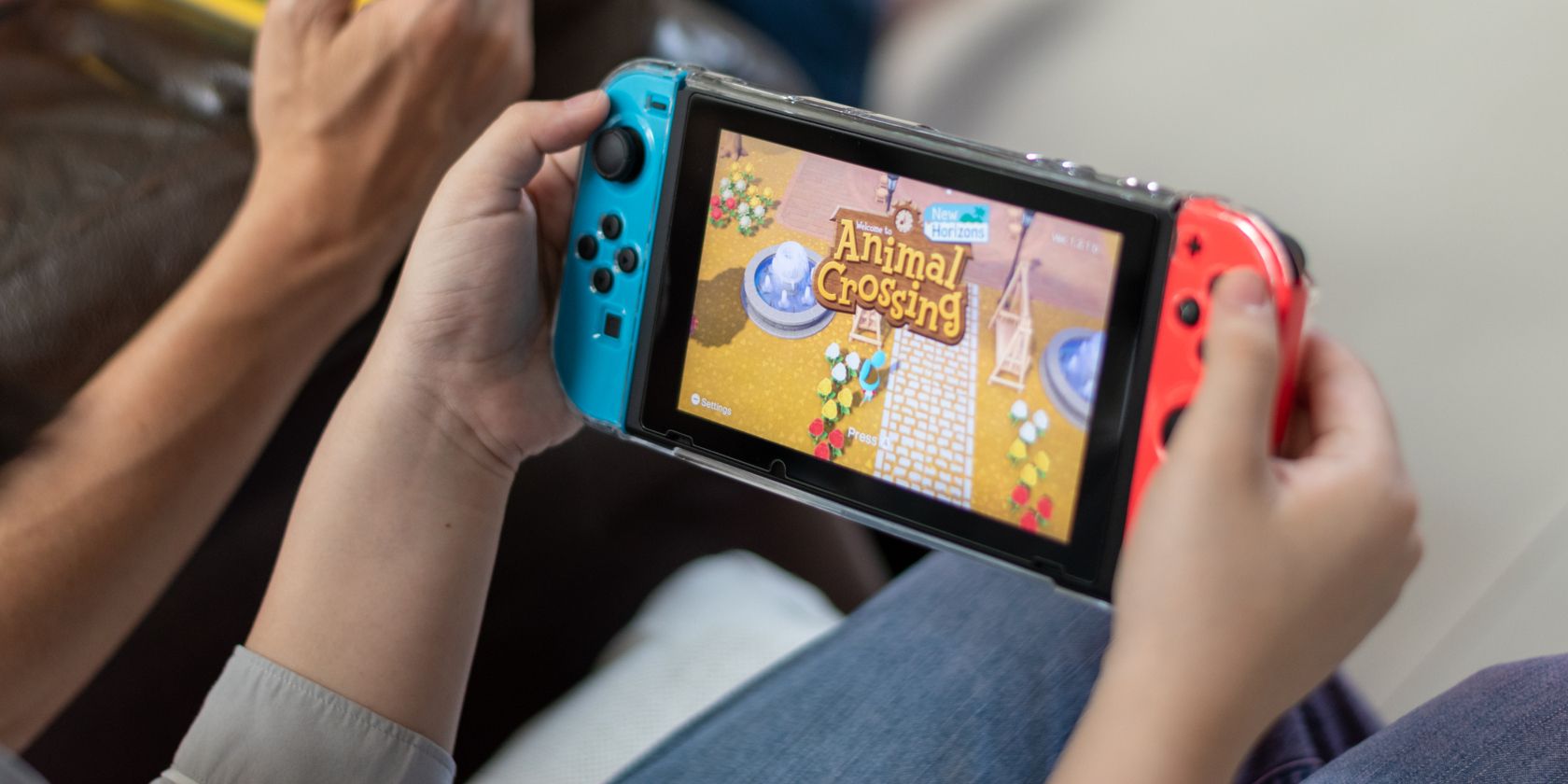 Person playing Animal Crossing on a Nintendo Switch
