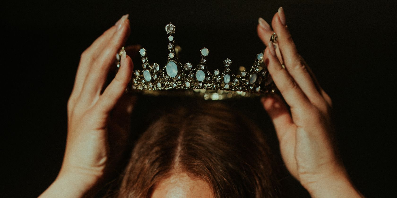 crown being placed on woman's head