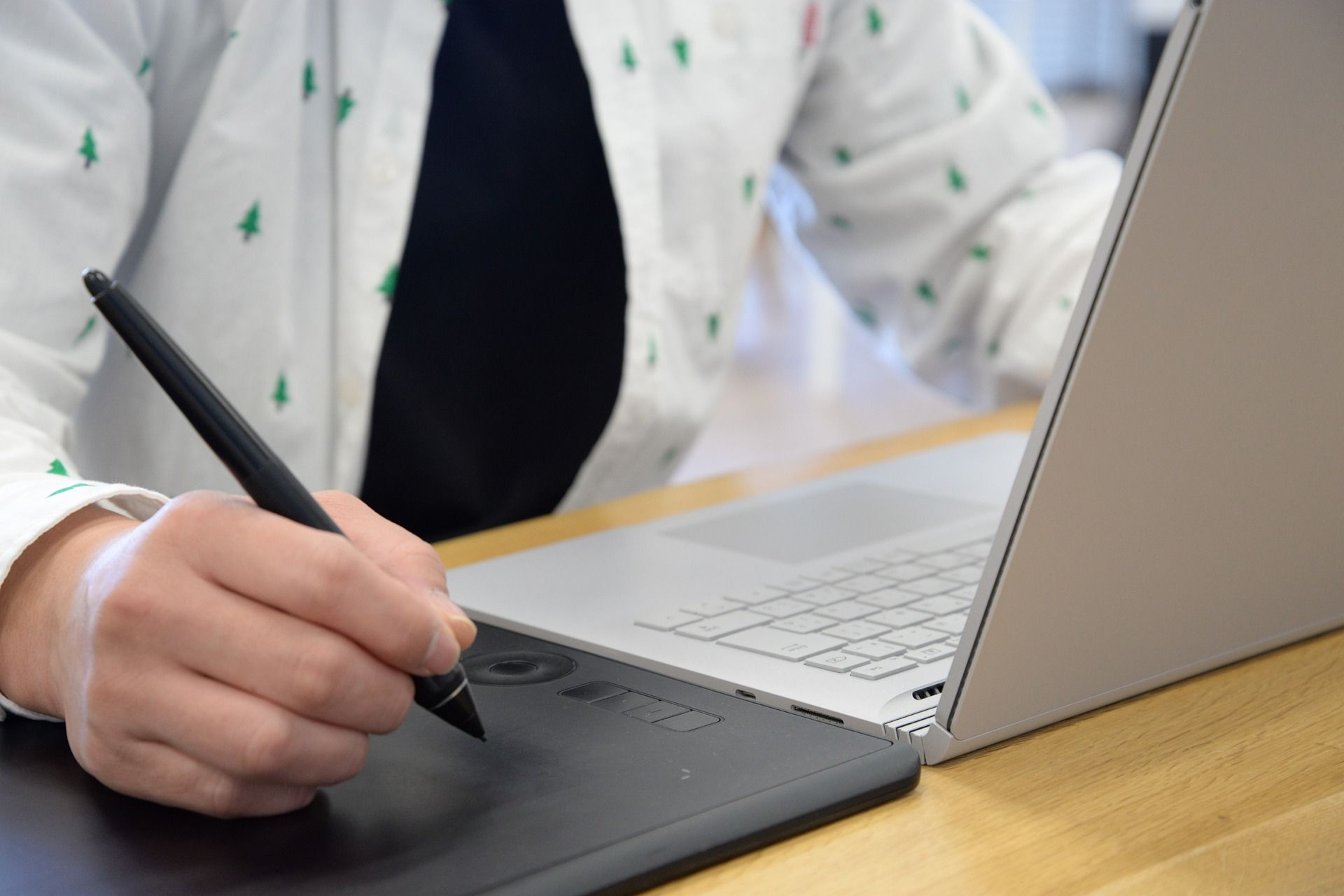 Photo of a person using a graphic tablet