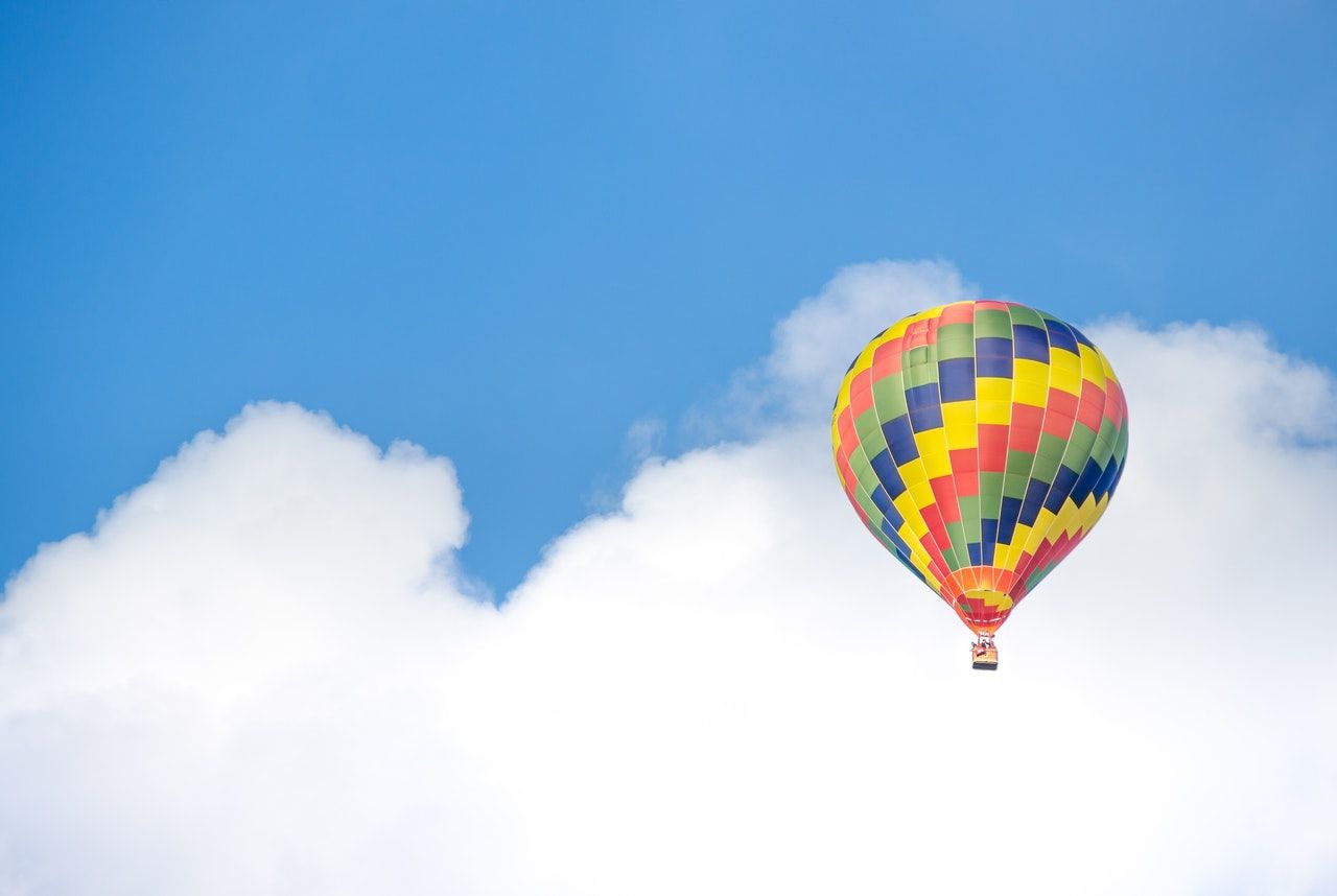 Multicolour hot air balloons flying in the sku
