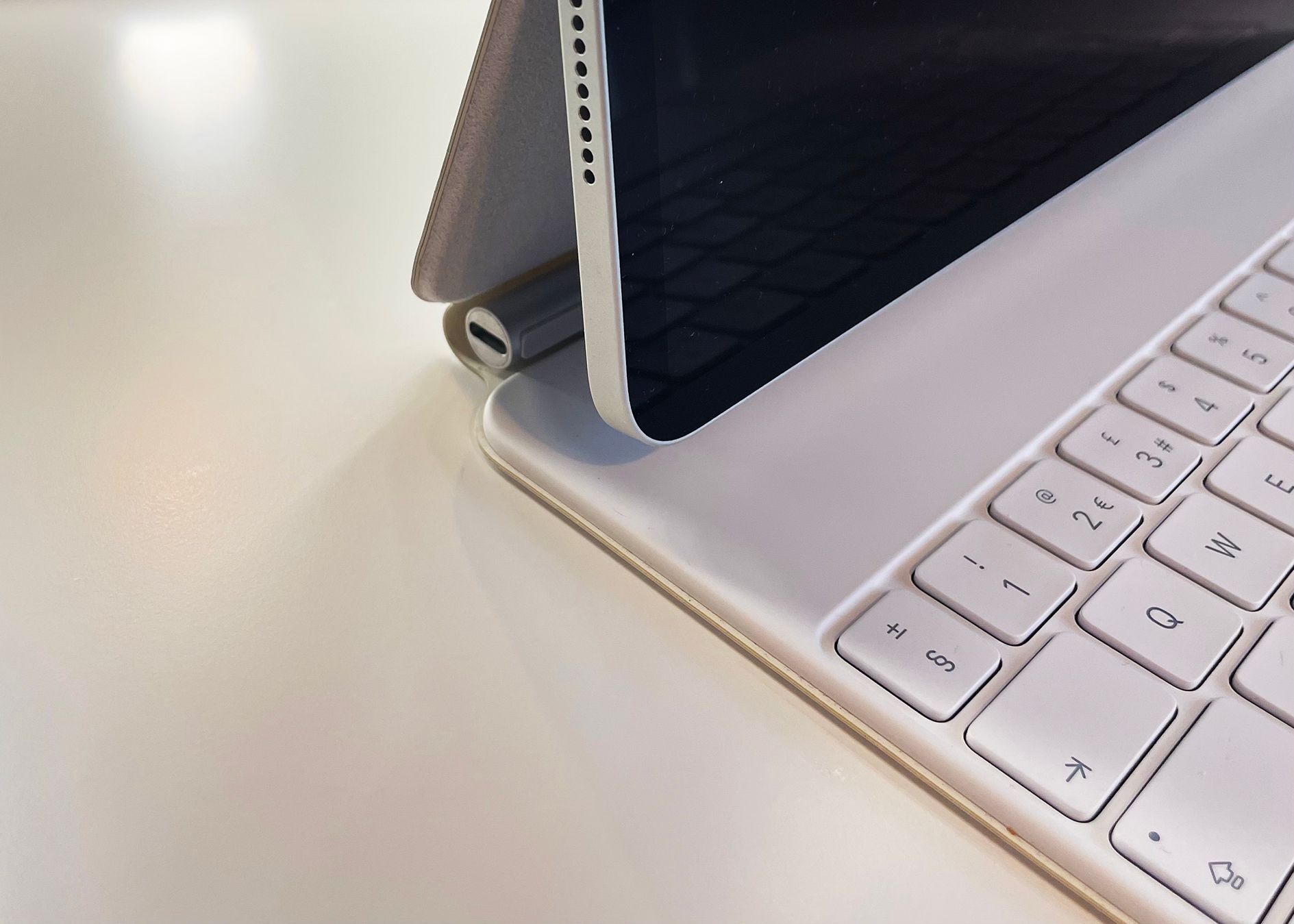 Close-up of a white iPad Pro Magic Keyboard Charging Port