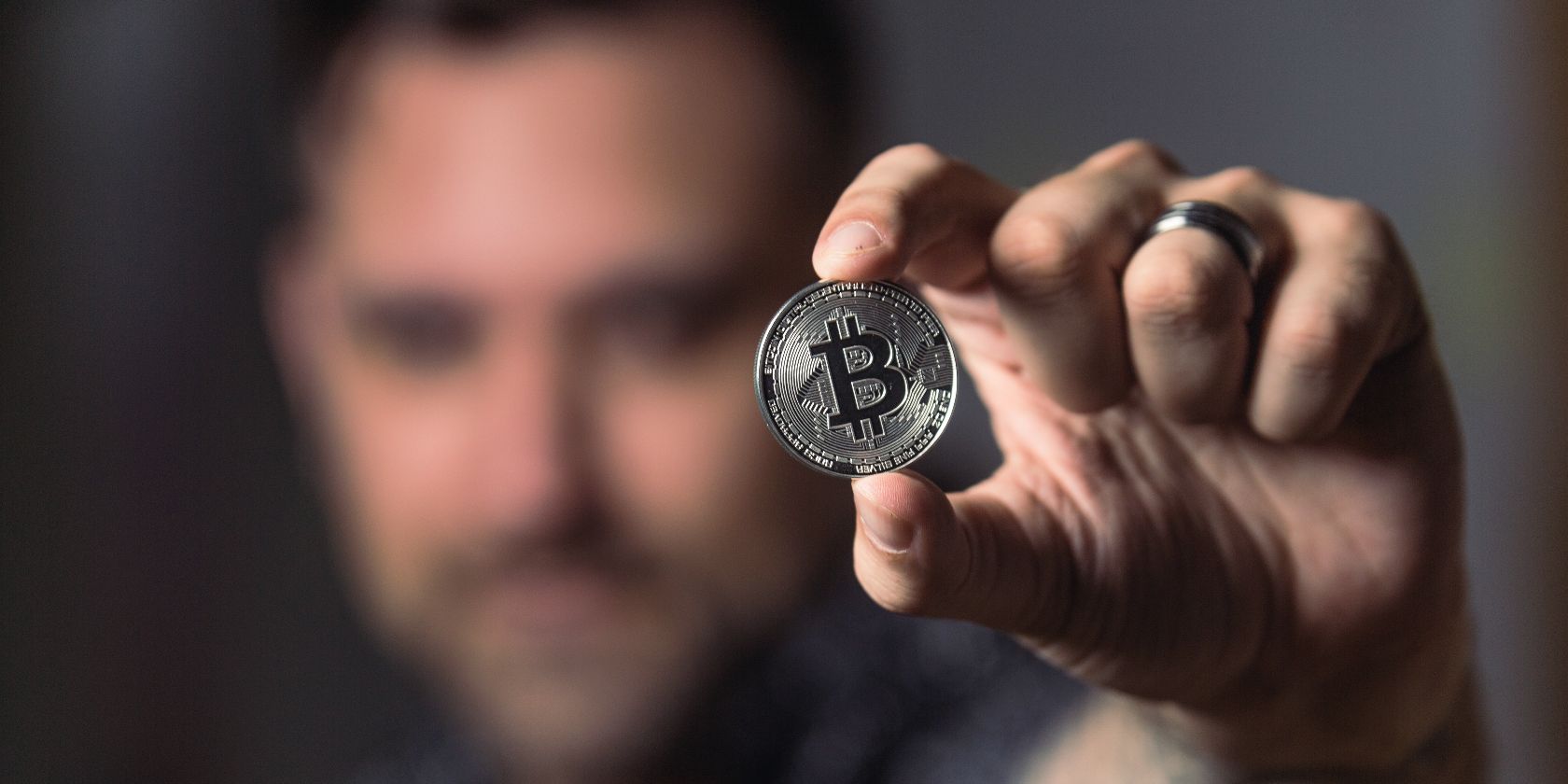 man holding bitcoin 