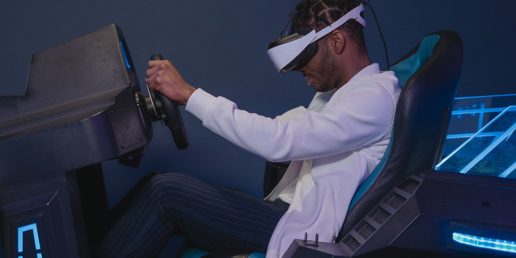 Man playing virtual reality racing game