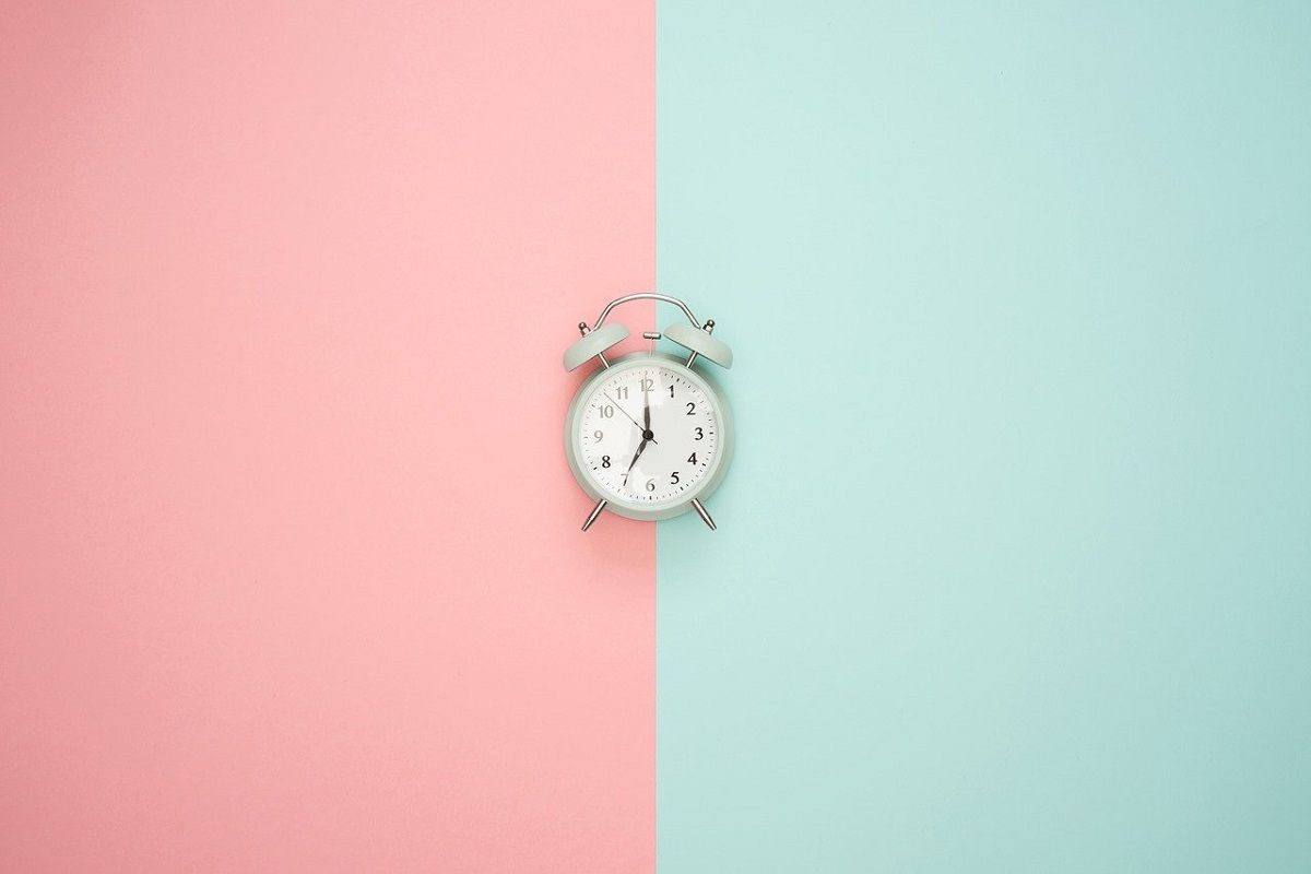 Photo of Analog Clock on Split Color Background