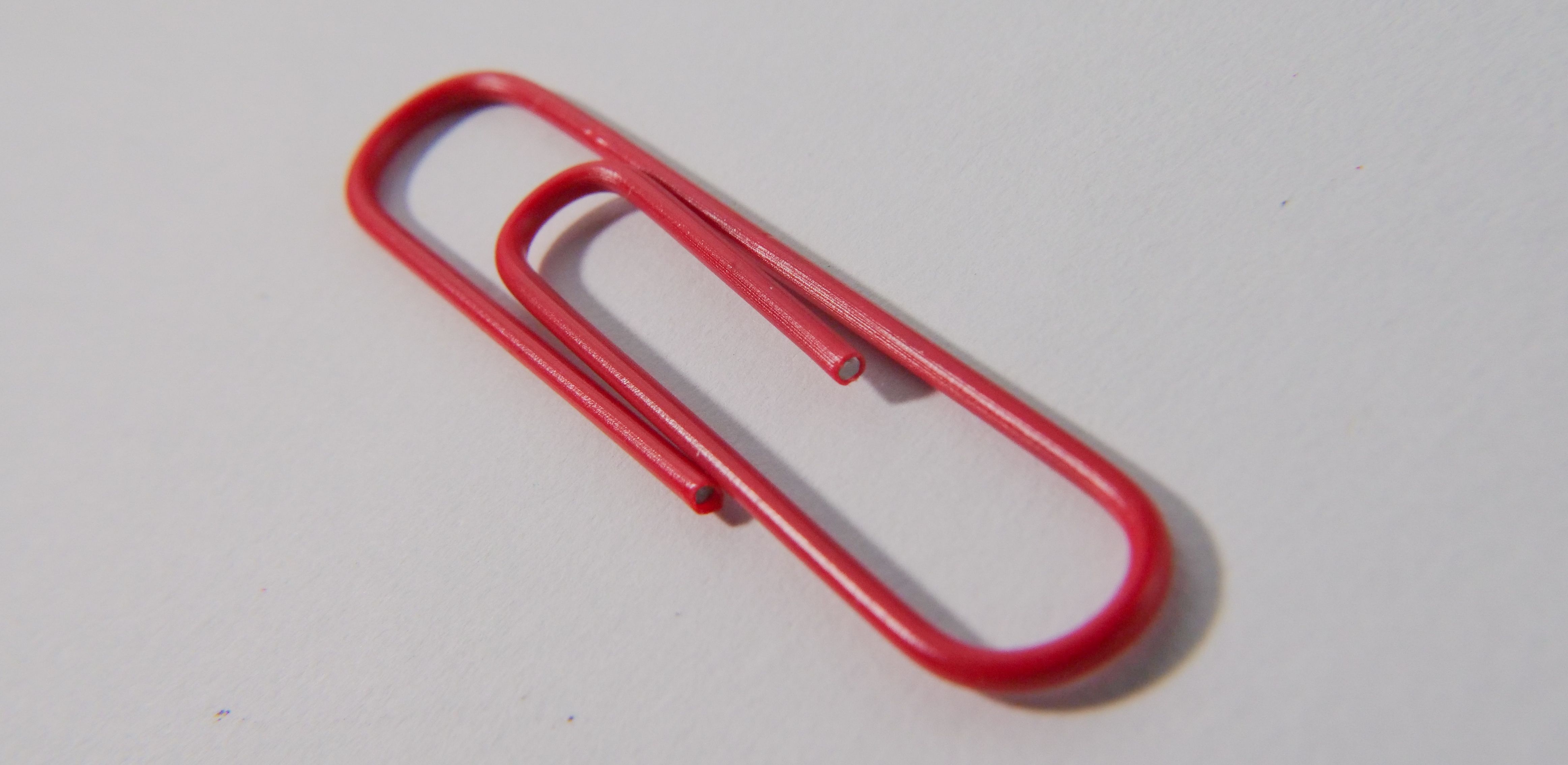 red paperclip on desk