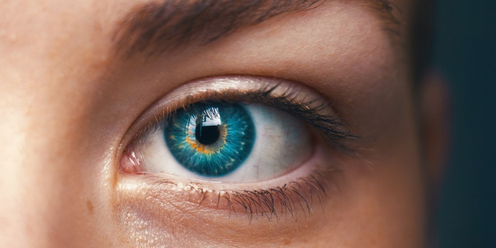 up-close photo of turquoise blue eye