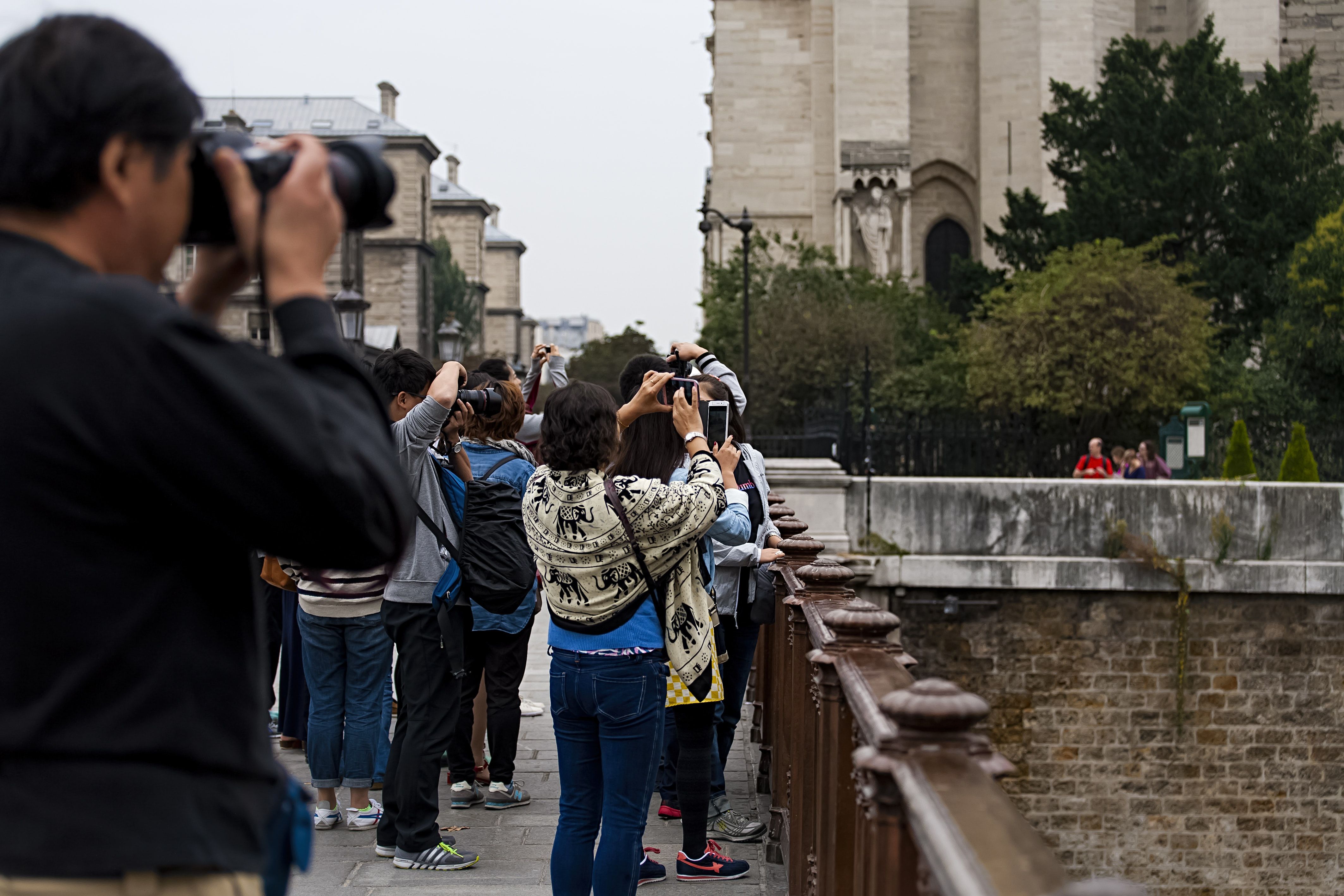 Photo of various people taking photos in the same place