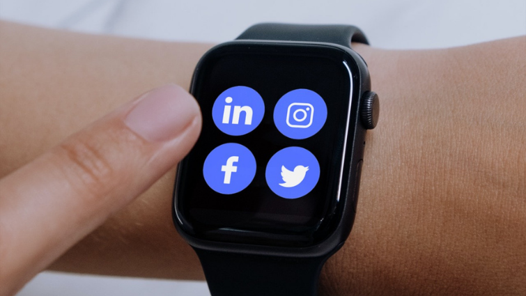 Black Apple Watch displaying social media apps