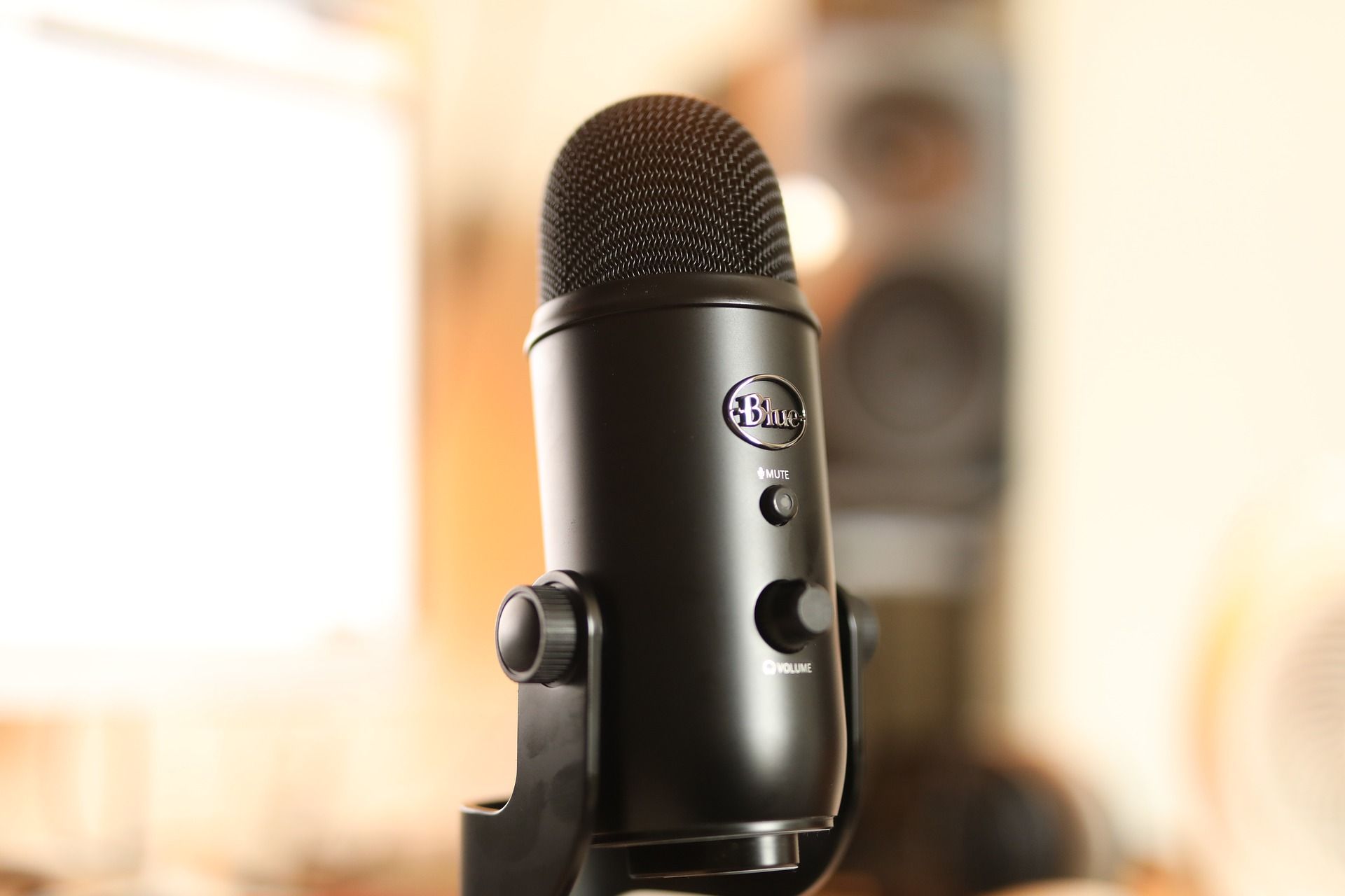 black blue yeti microphone against blurred background