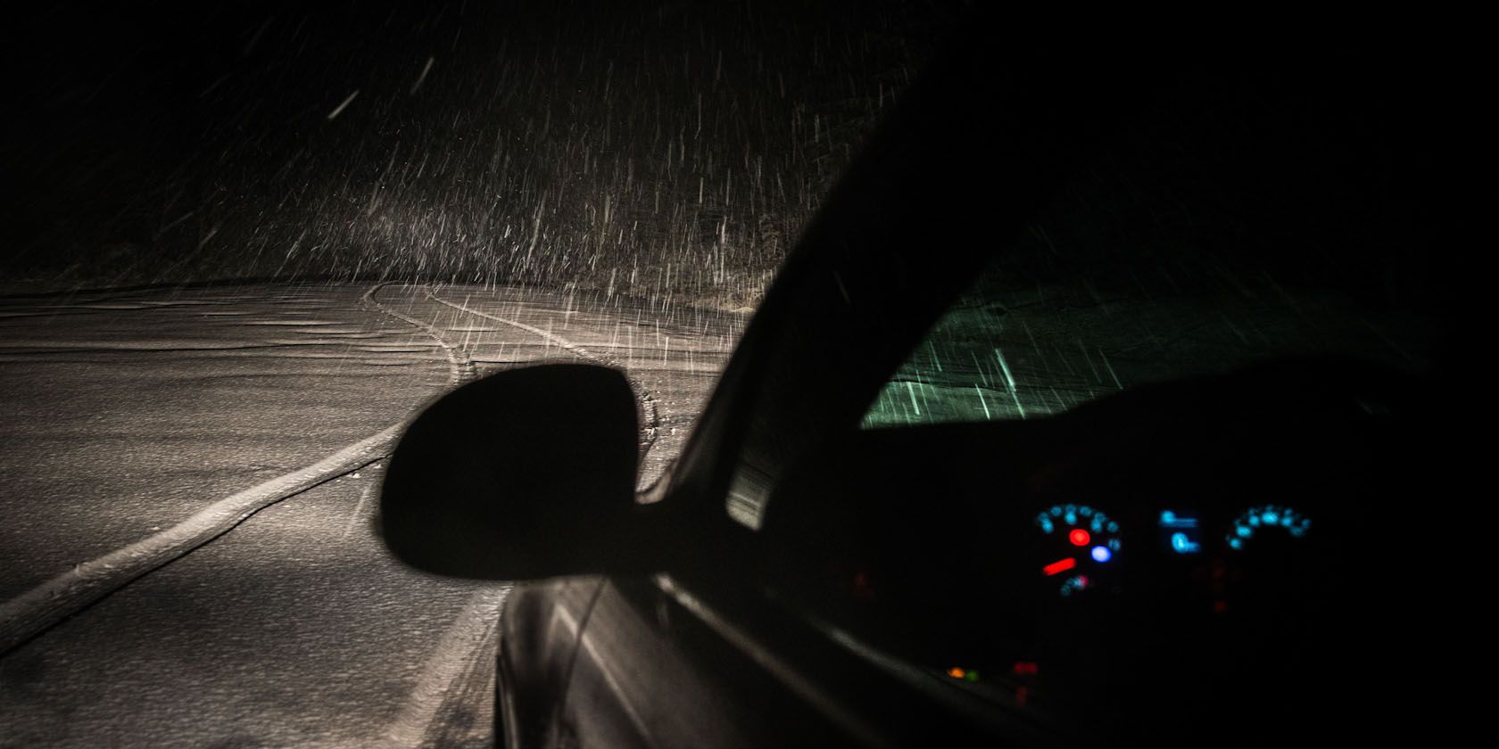 Car at night under rain.