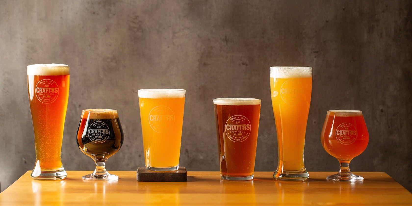 craft beer glasses in a line on table