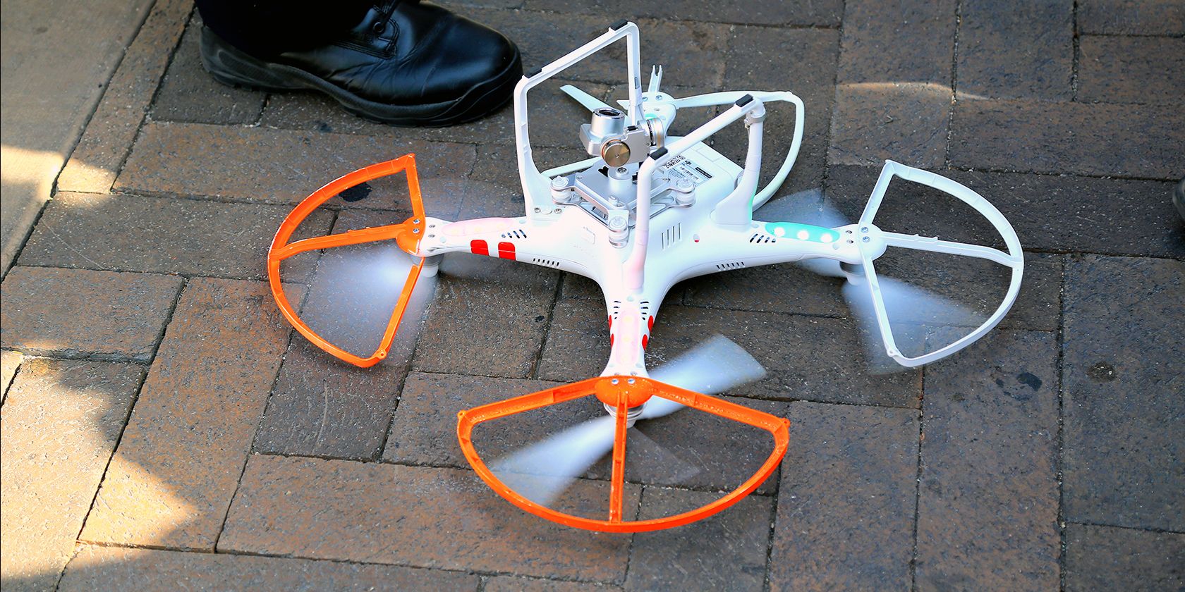 inverted crashed drone on the pavement
