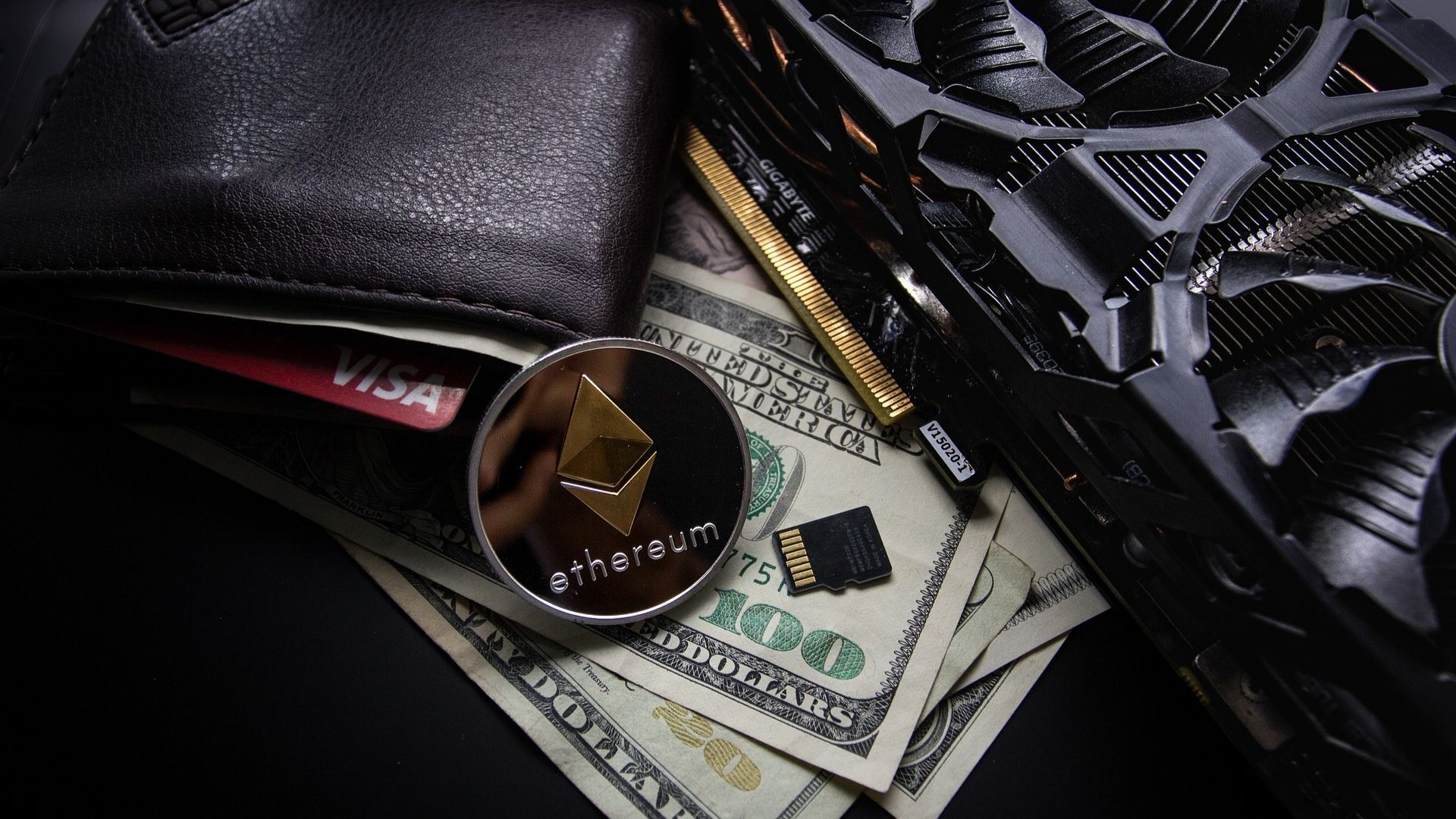 ethereum commemorative coin next to a wallet 