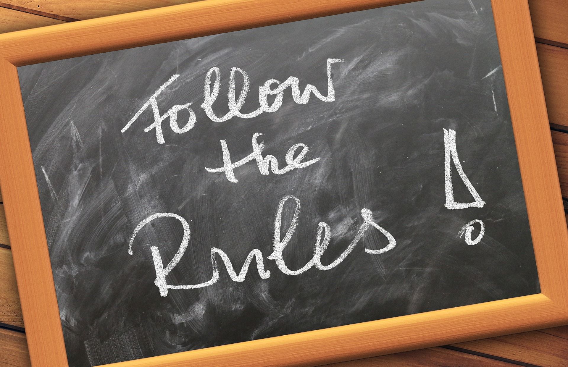 Follow the Rules Written on Chalkboard