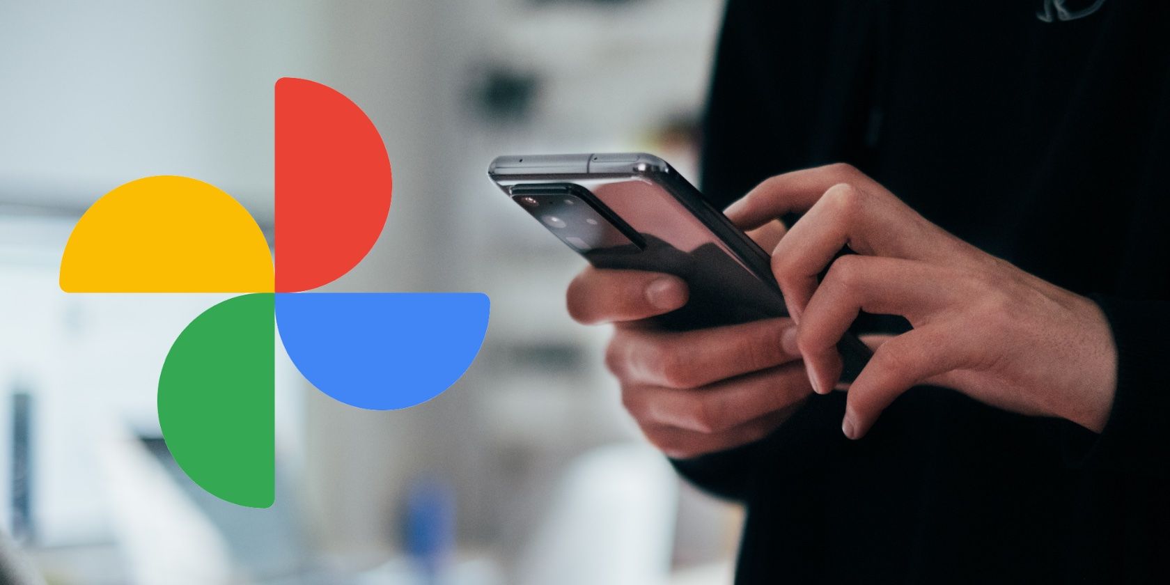 hands using phone with google photos logo