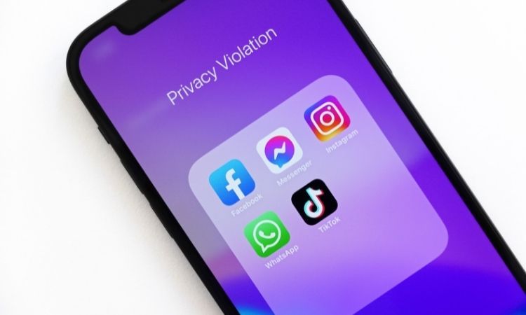 iPhone folder titled "privacy violation' with social media apps in it