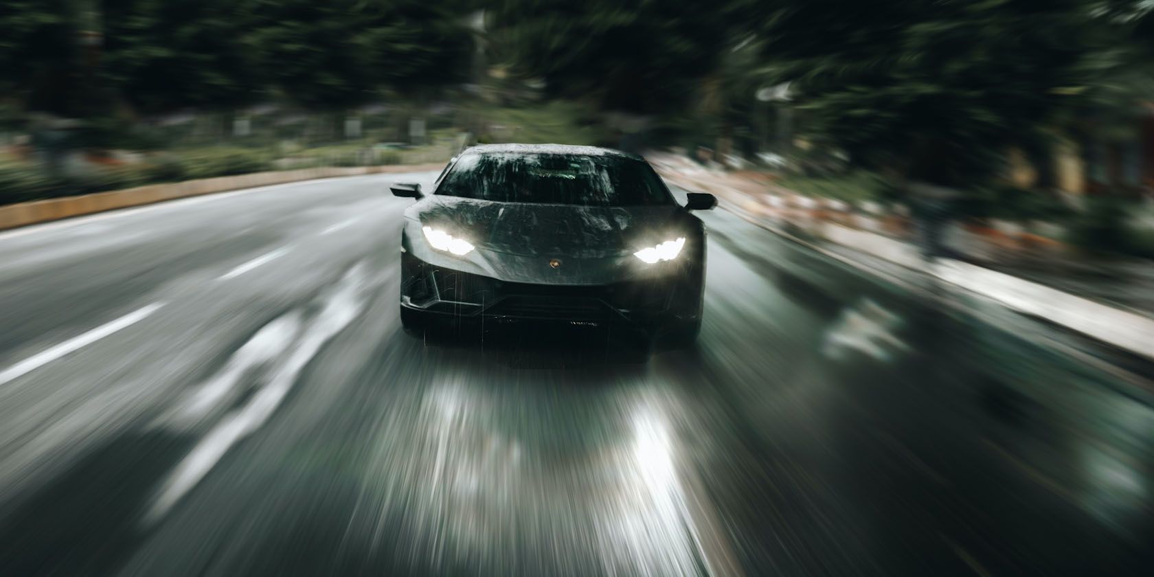Lamborghini speeding with lights on.