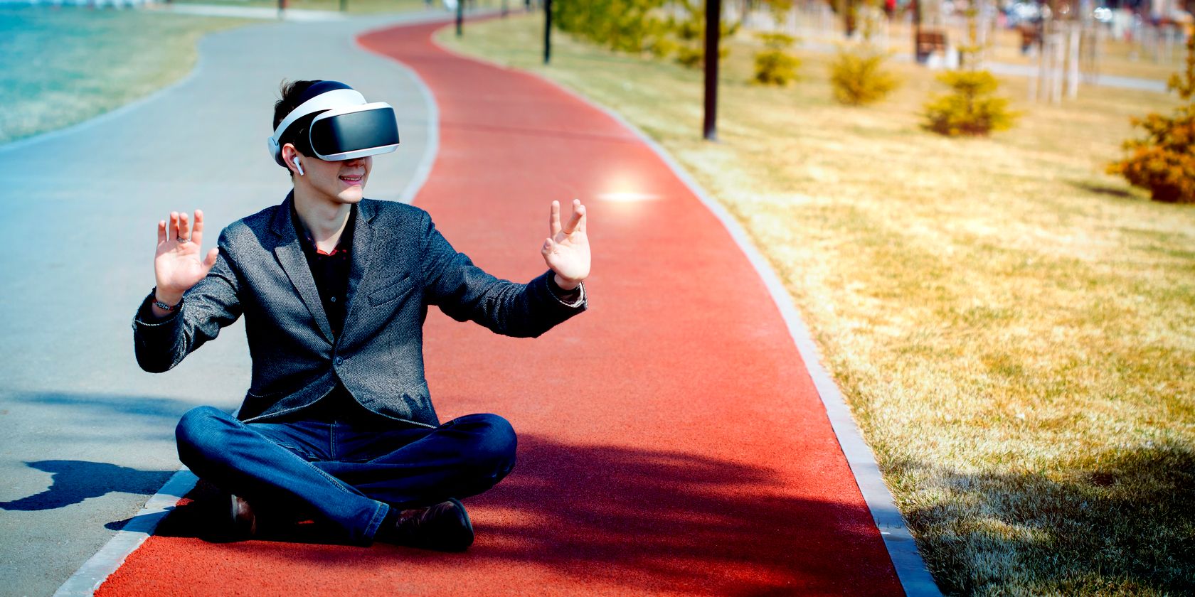 man wearing virtual reality headset outdoors feature