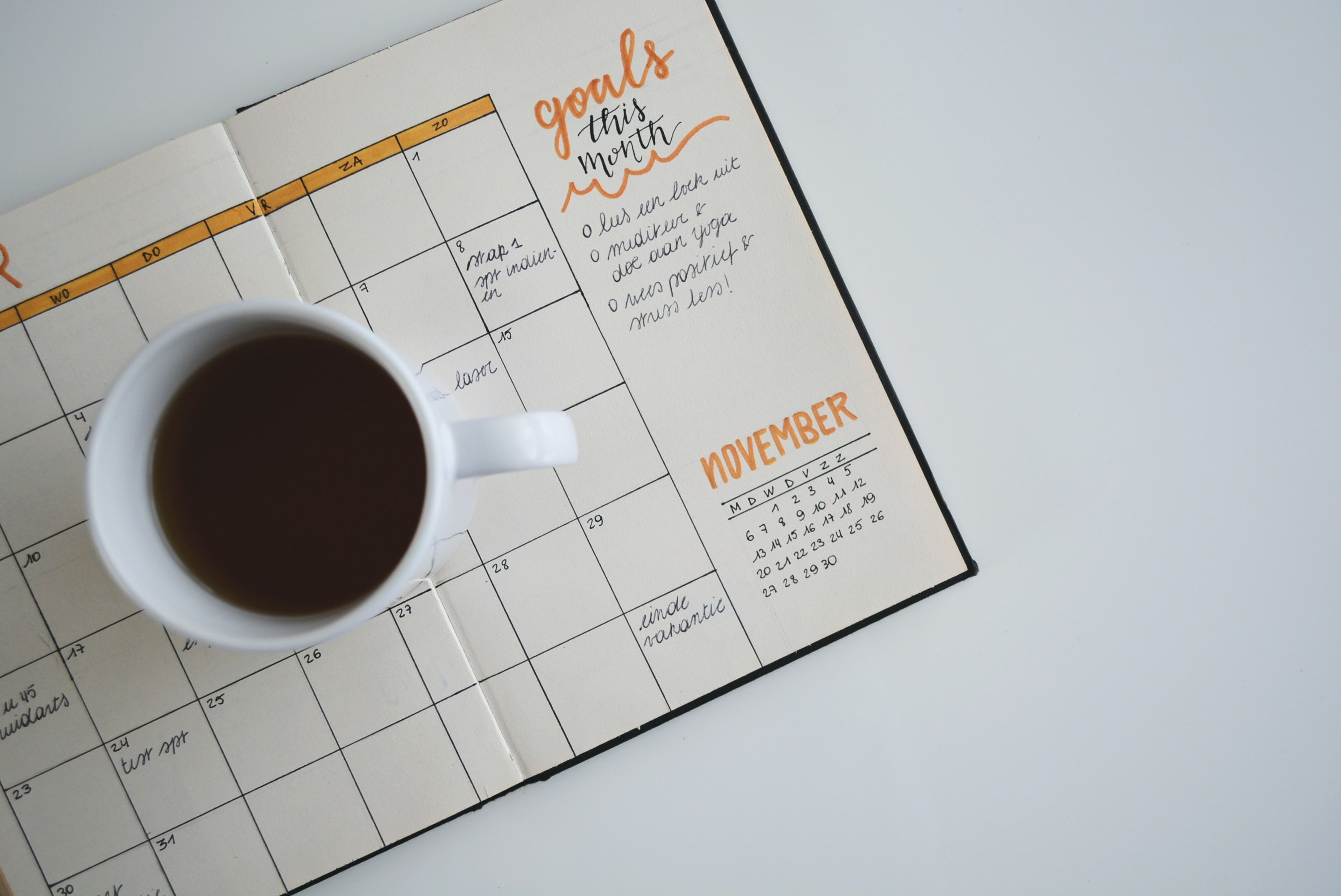 A homemade calendar and some coffee.