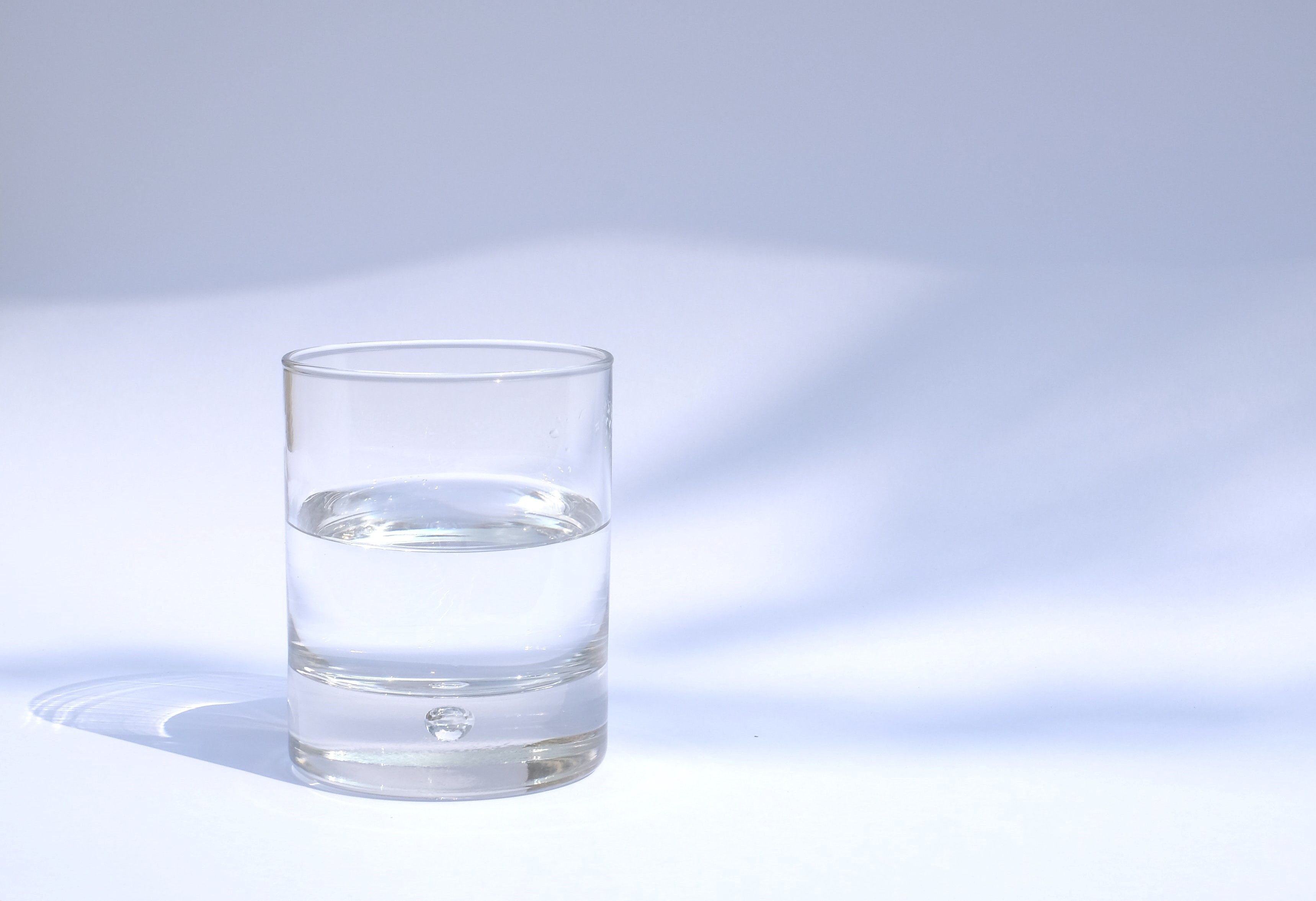 A glass of water on a white cyc.