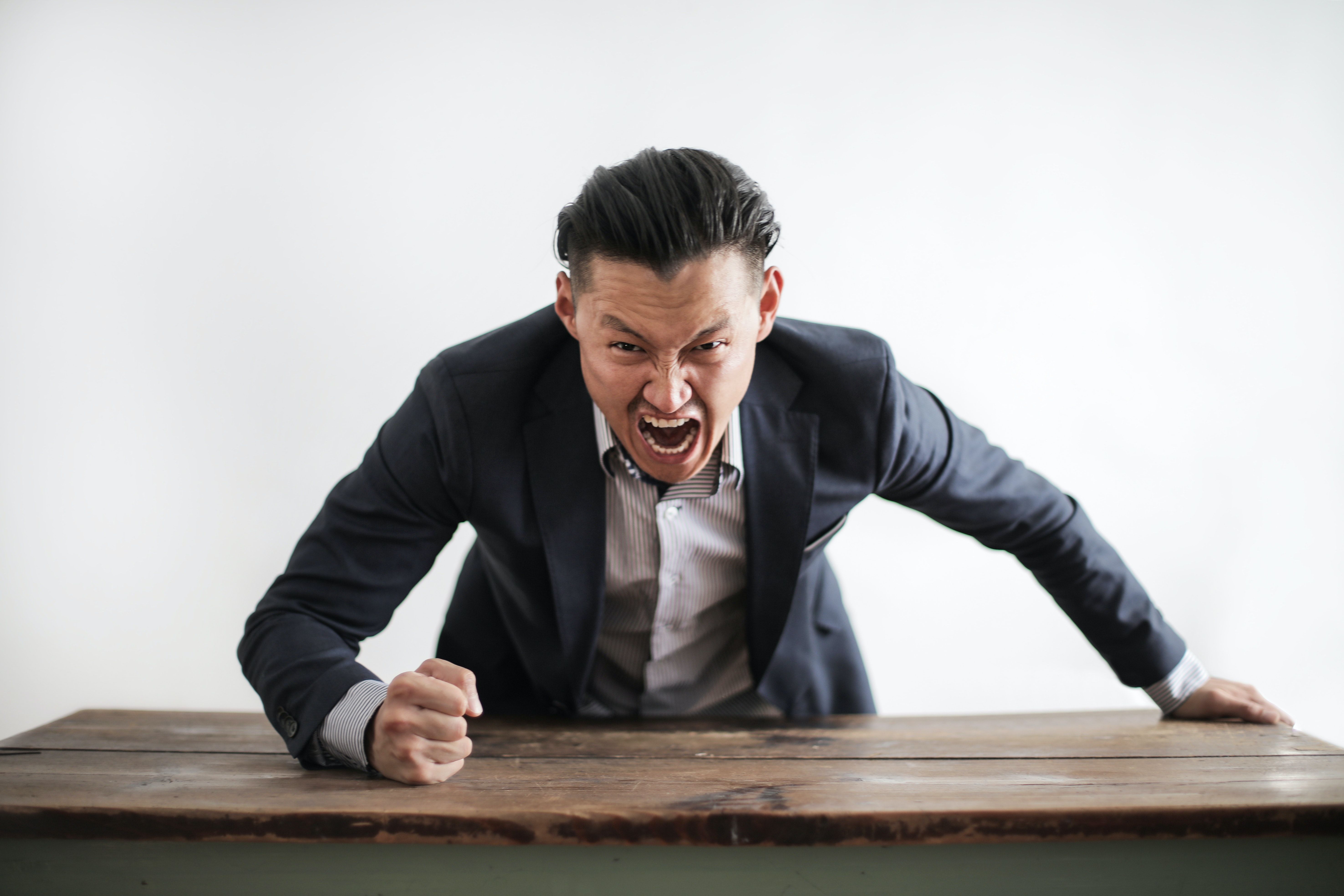 A man showing rage in office