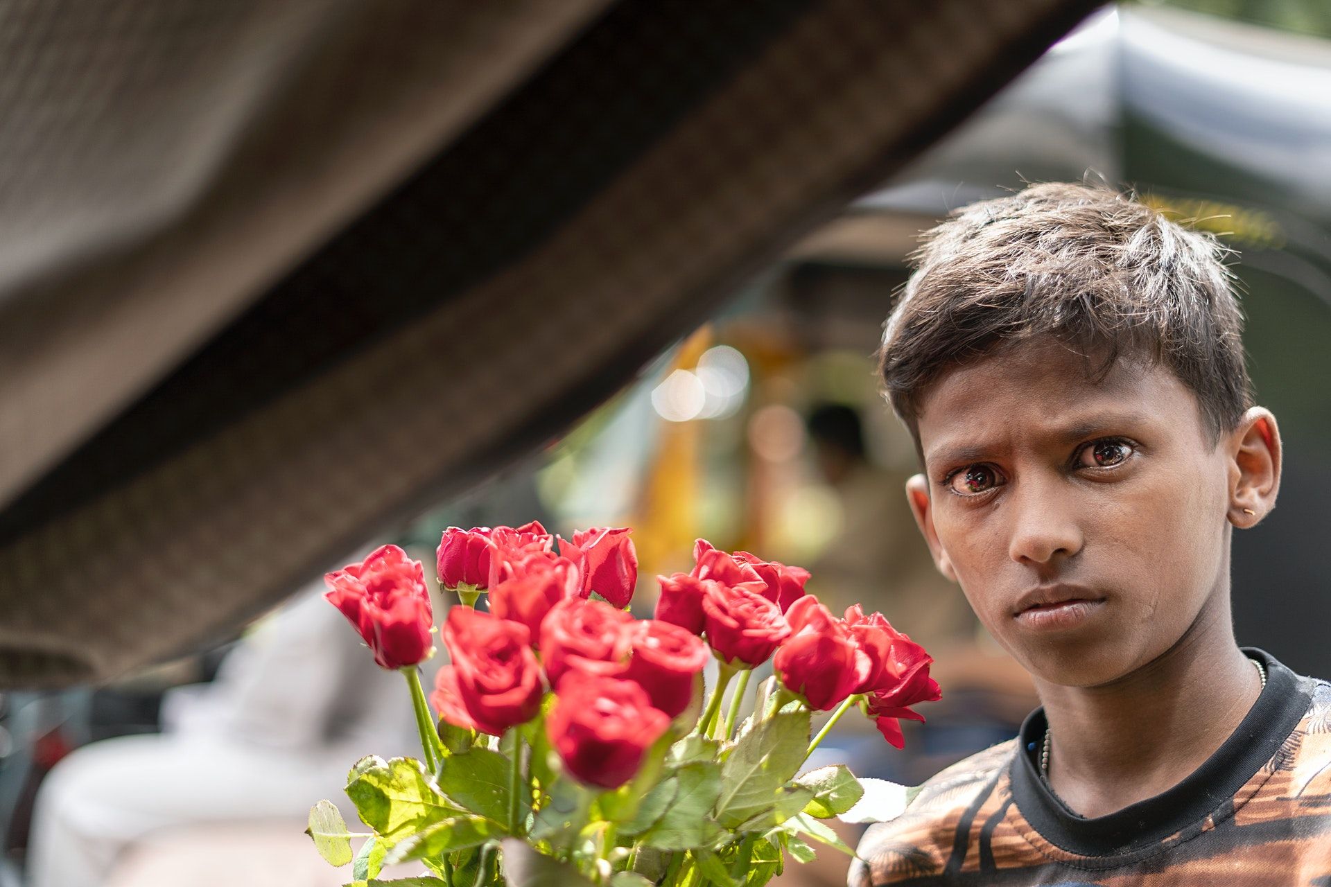 Boy selling flowers