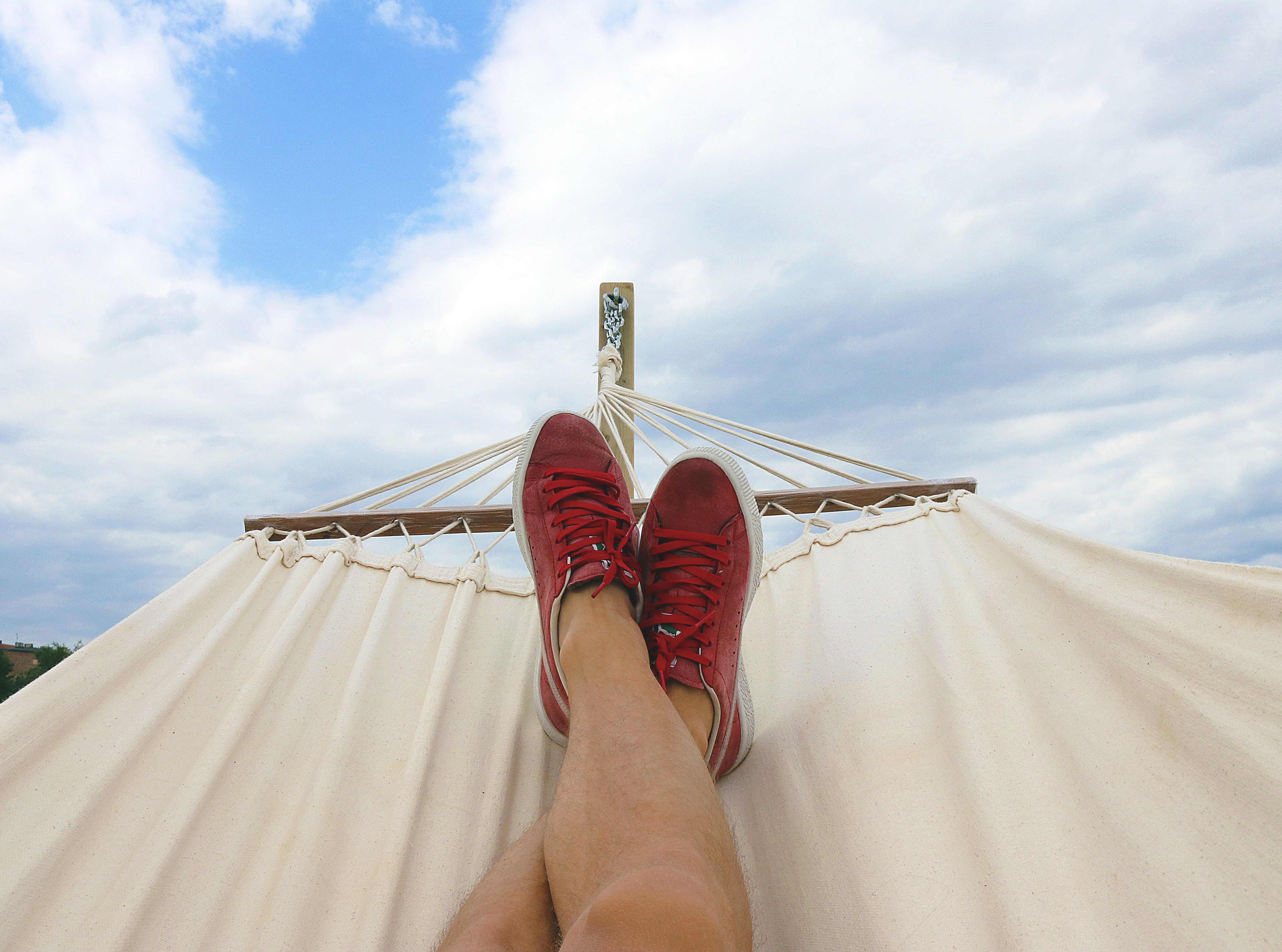 A person relaxing on a hammock