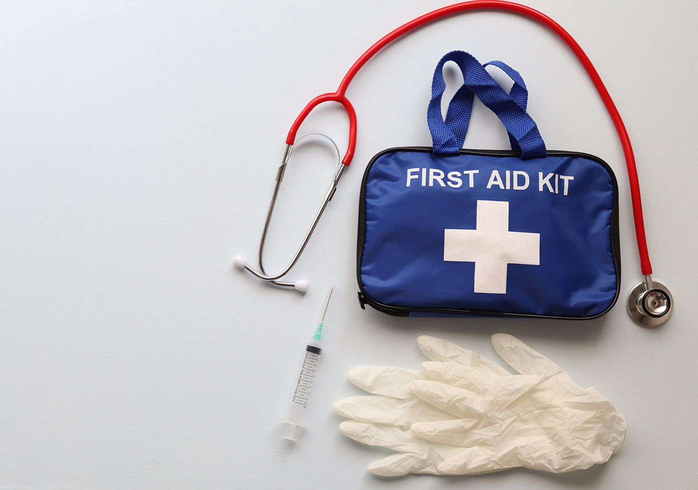 First aid kit and gloves
