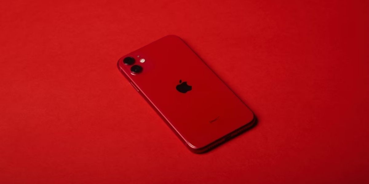 red iphone on red surface