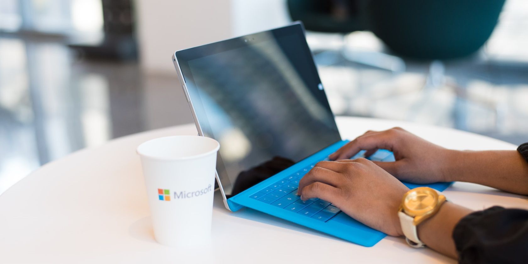 Woman using blue Microsoft Surface
