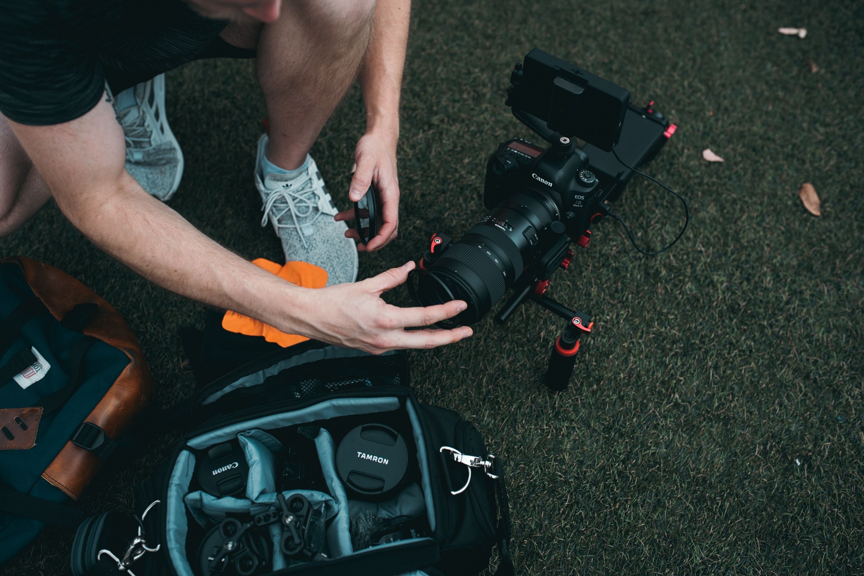 Photo of a person using gear in a camera bag