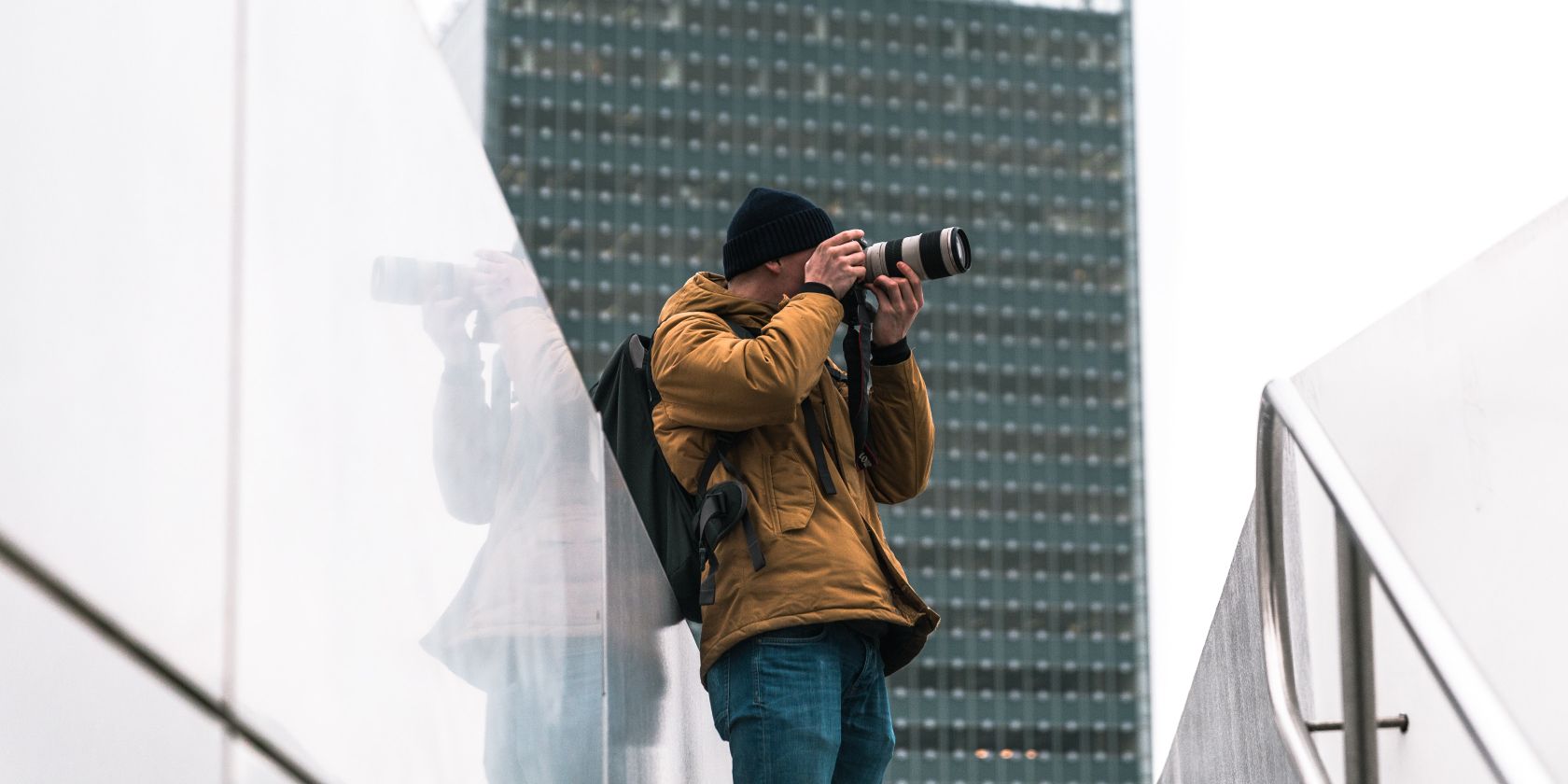 Photo of a person taking pictures in a city