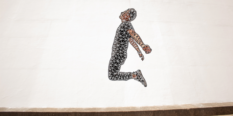 Image of man jumping midair with Photoshop puppet warp mesh on him.