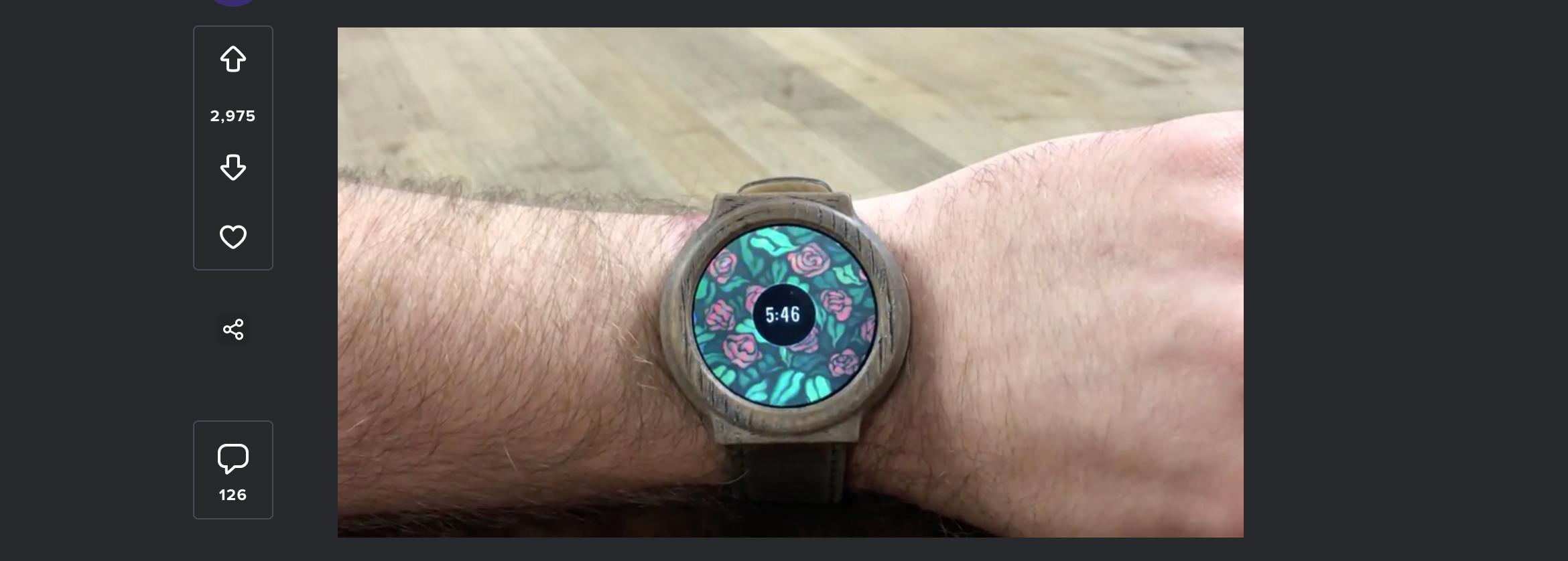 A screenshot showing a photo of a smartwatch on a persons wrist