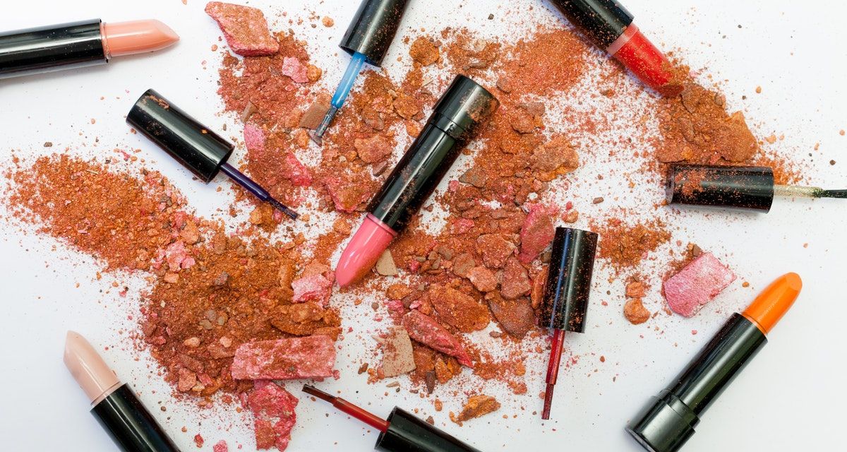 assorted lipsticks with pulverized powder