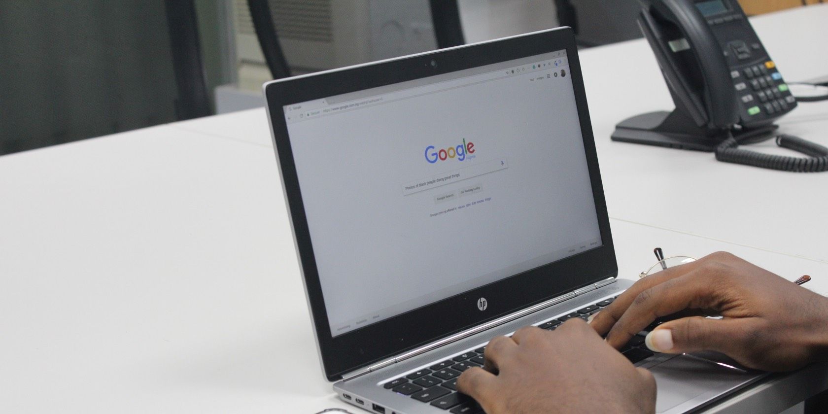 Man Using Google on Laptop