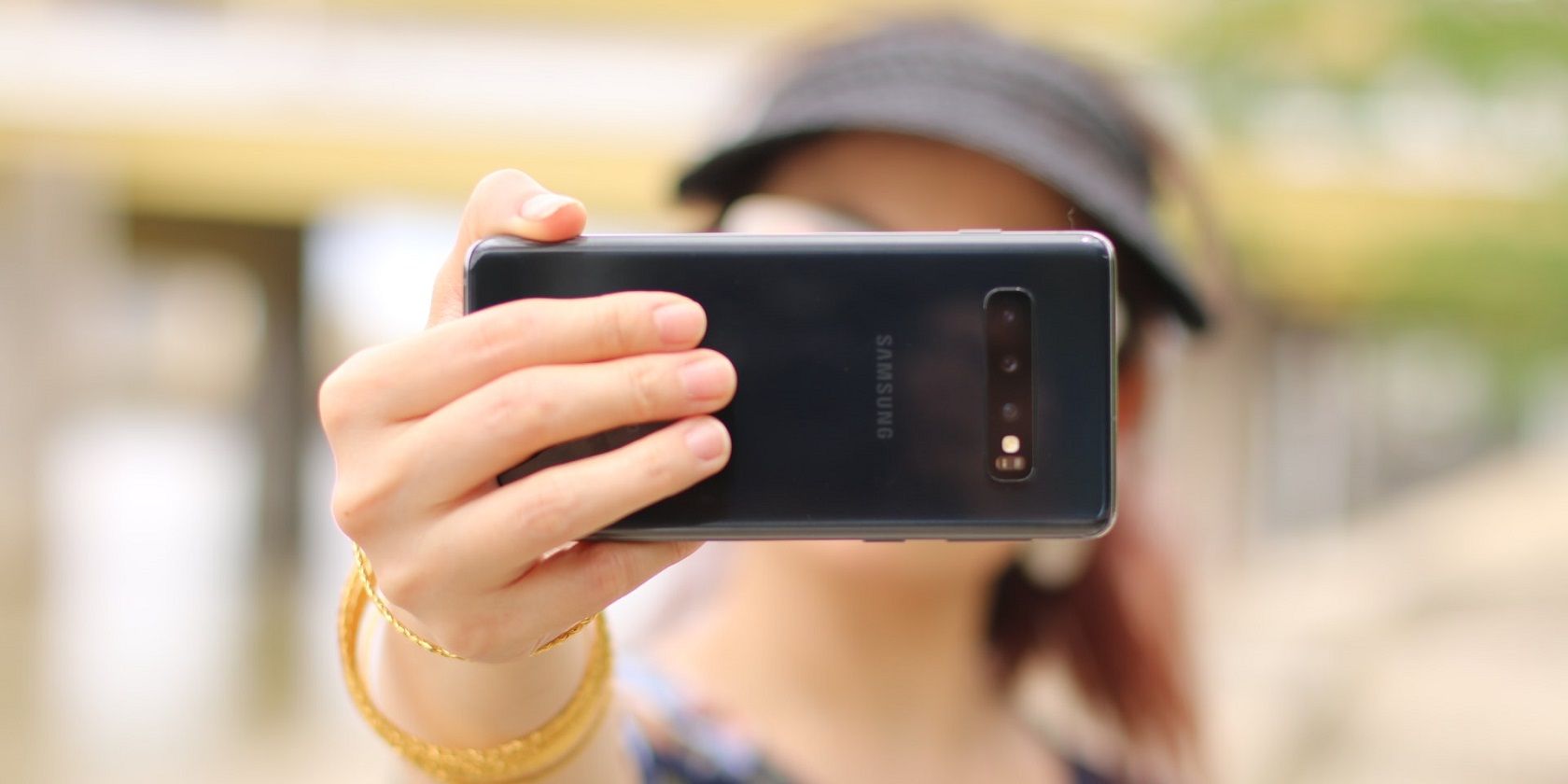Person taking a selfie with a Samsung smartphone