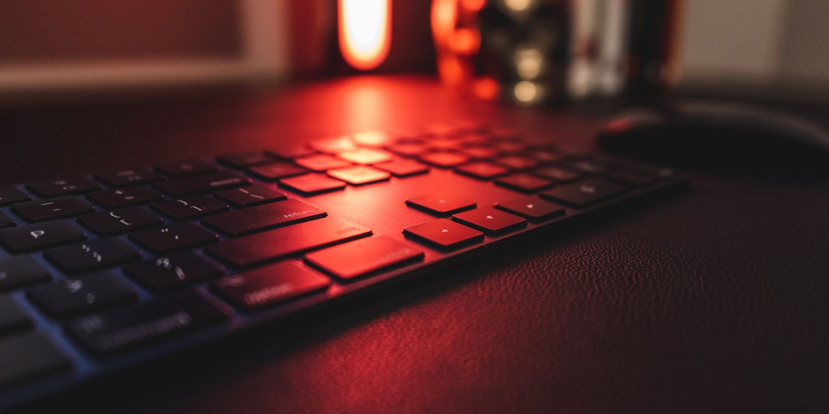closeup of a keyboard lit by a red light