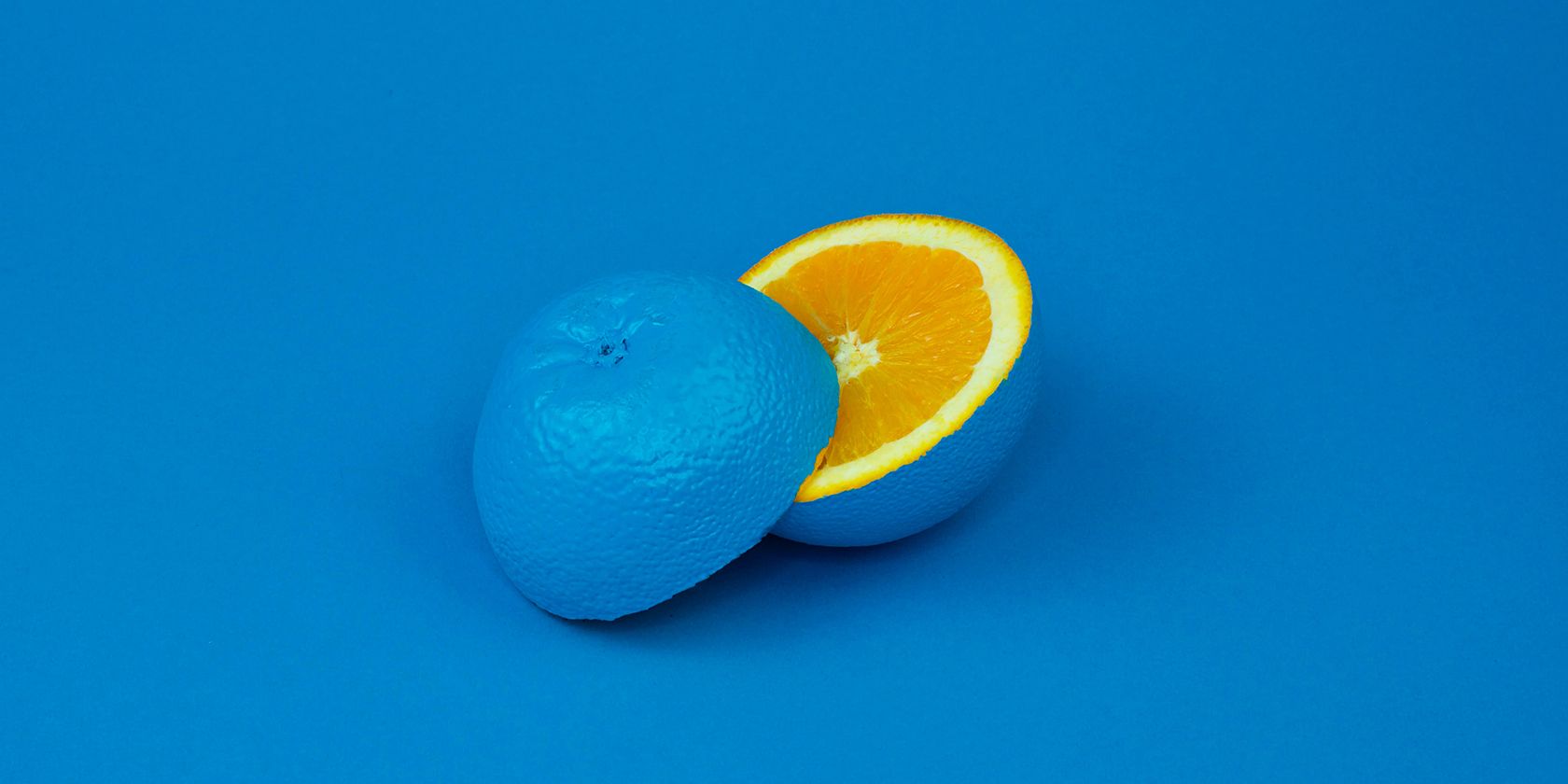 An orange painted with its complement, blue.