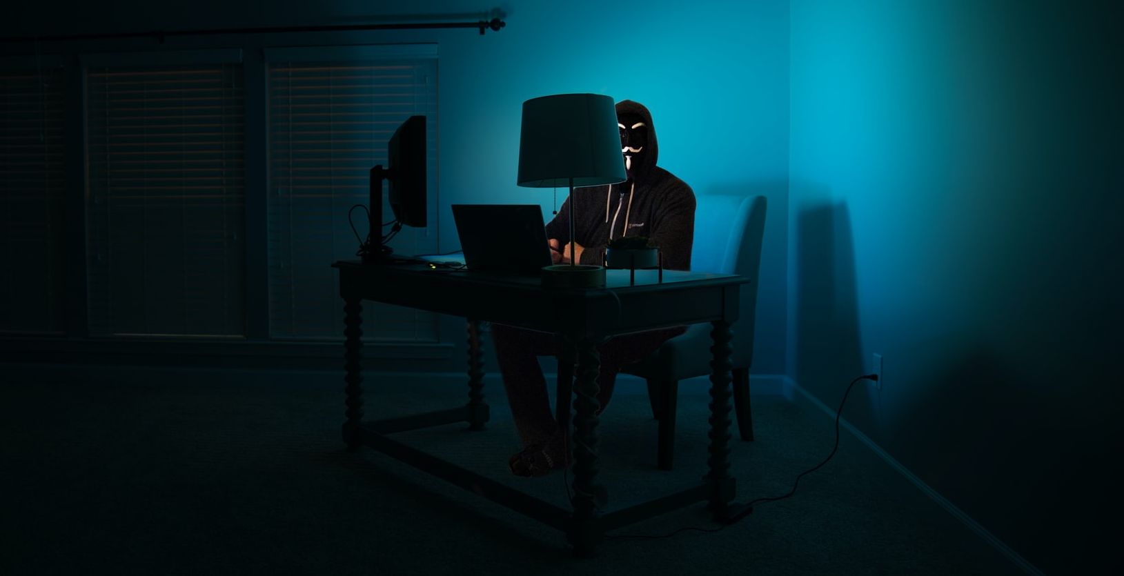 Cyberattacker using a laptop