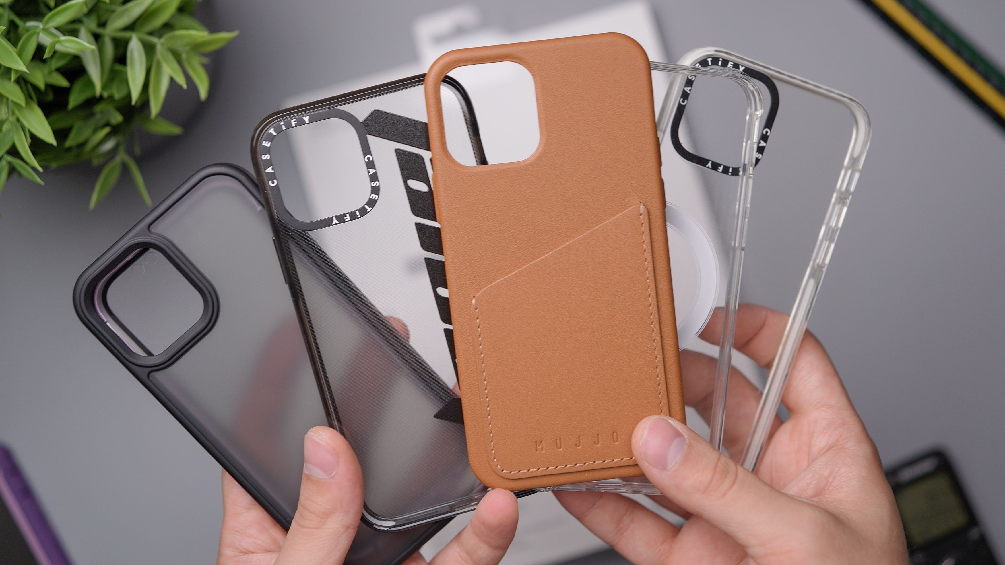 Person holding iPhone cases
